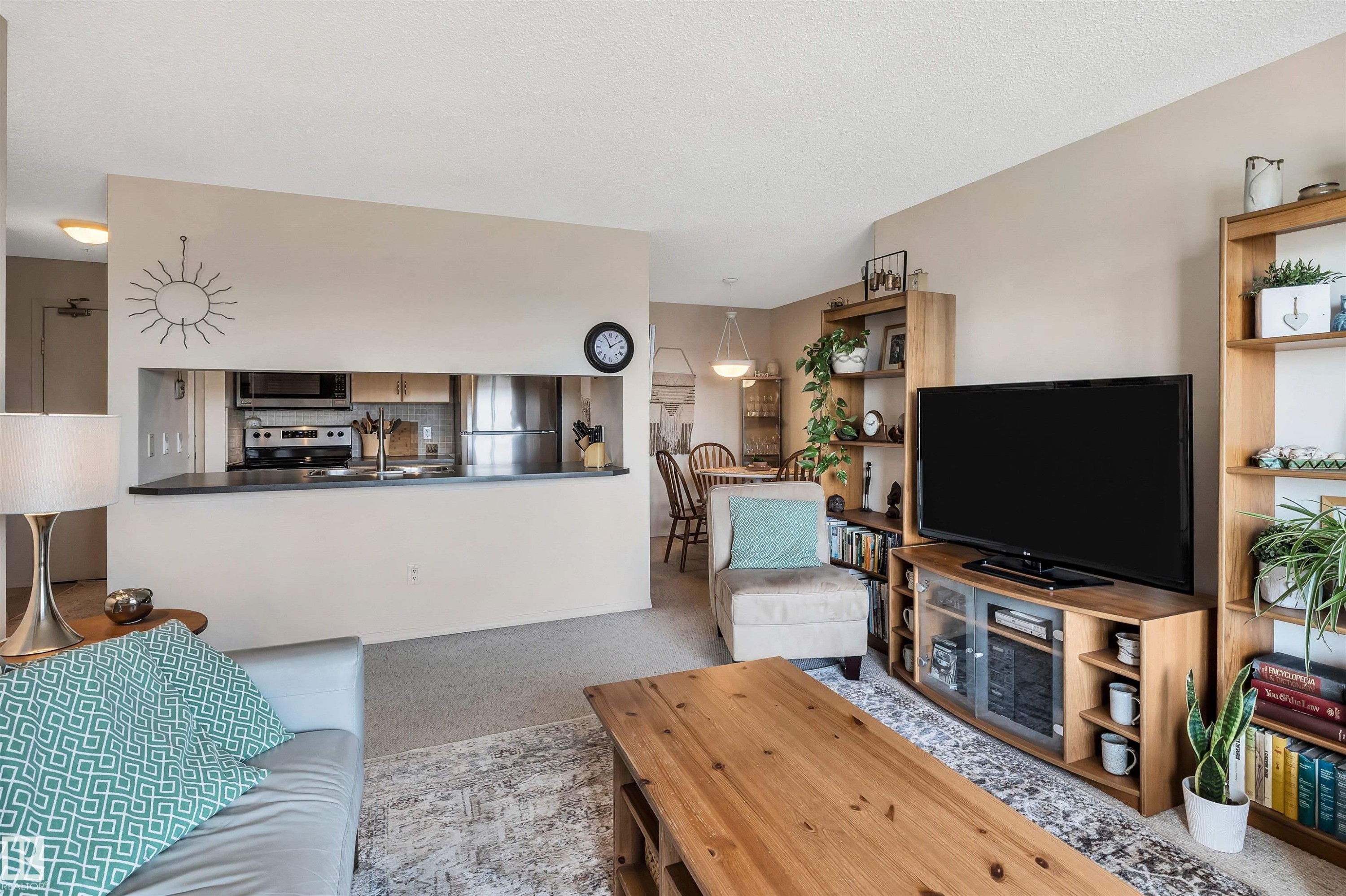 409 2430 Guardian Road, Edmonton, AB - Indoor Photo Showing Living Room