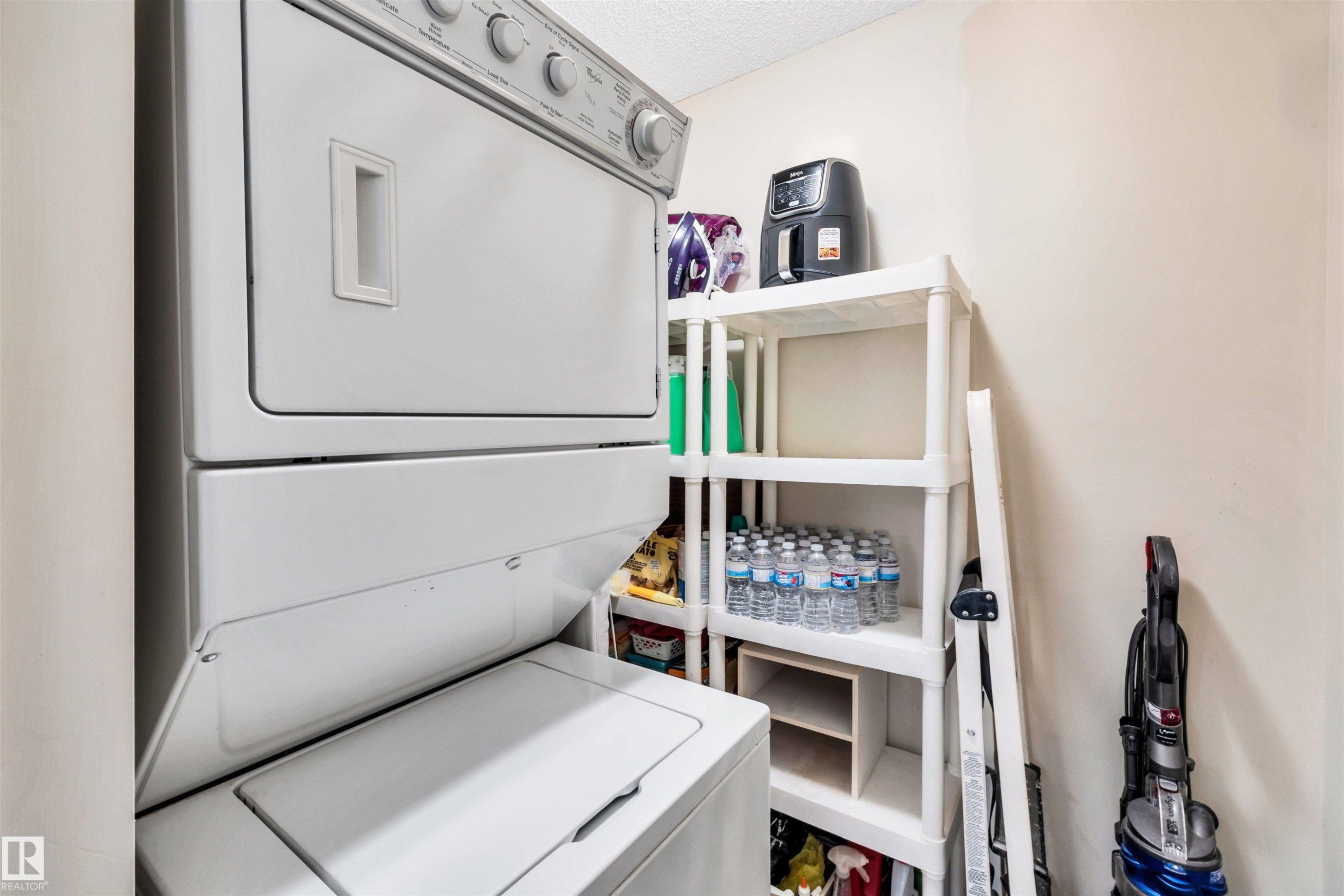 409 2430 Guardian Road, Edmonton, AB - Indoor Photo Showing Laundry Room