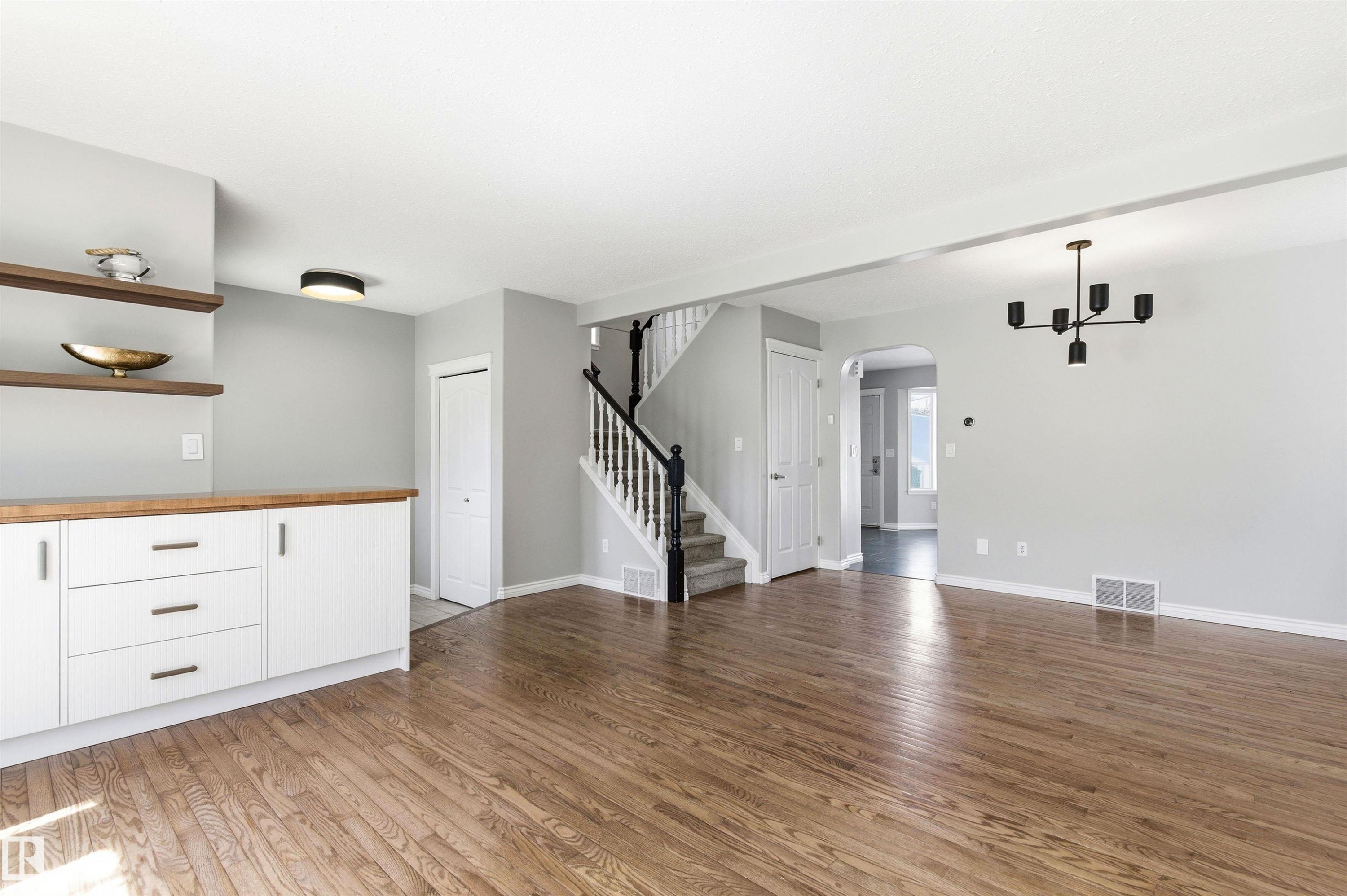 Open concept living area featuring hardwood flooring - 8730 92A Avenue, Edmonton, AB - Indoor