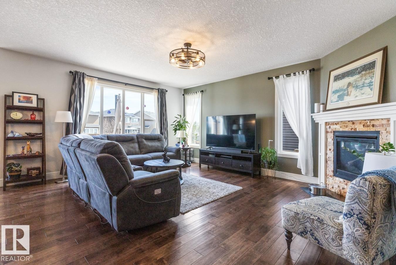 357 Simpkins Wynd, Leduc, AB - Indoor Photo Showing Living Room With Fireplace