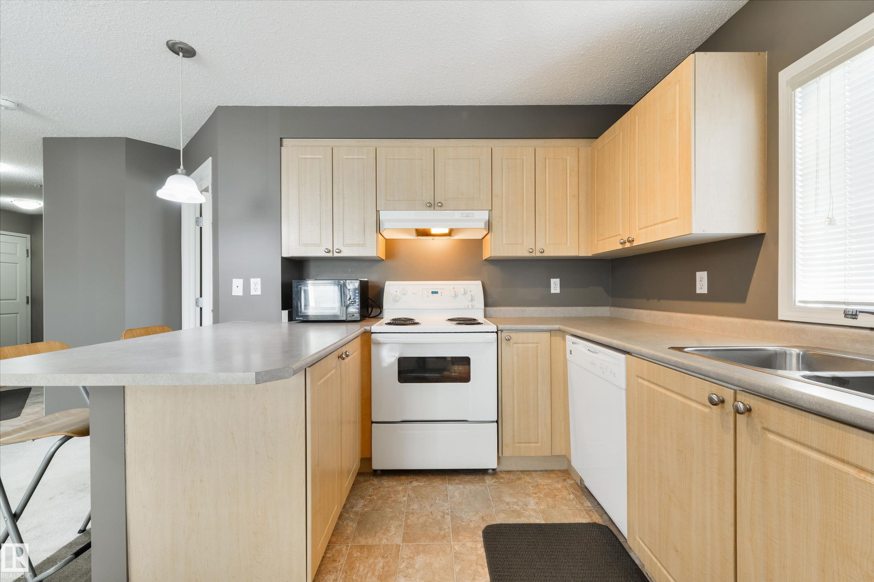 202 622 Mcallister Loop, Edmonton, AB - Indoor Photo Showing Kitchen With Double Sink