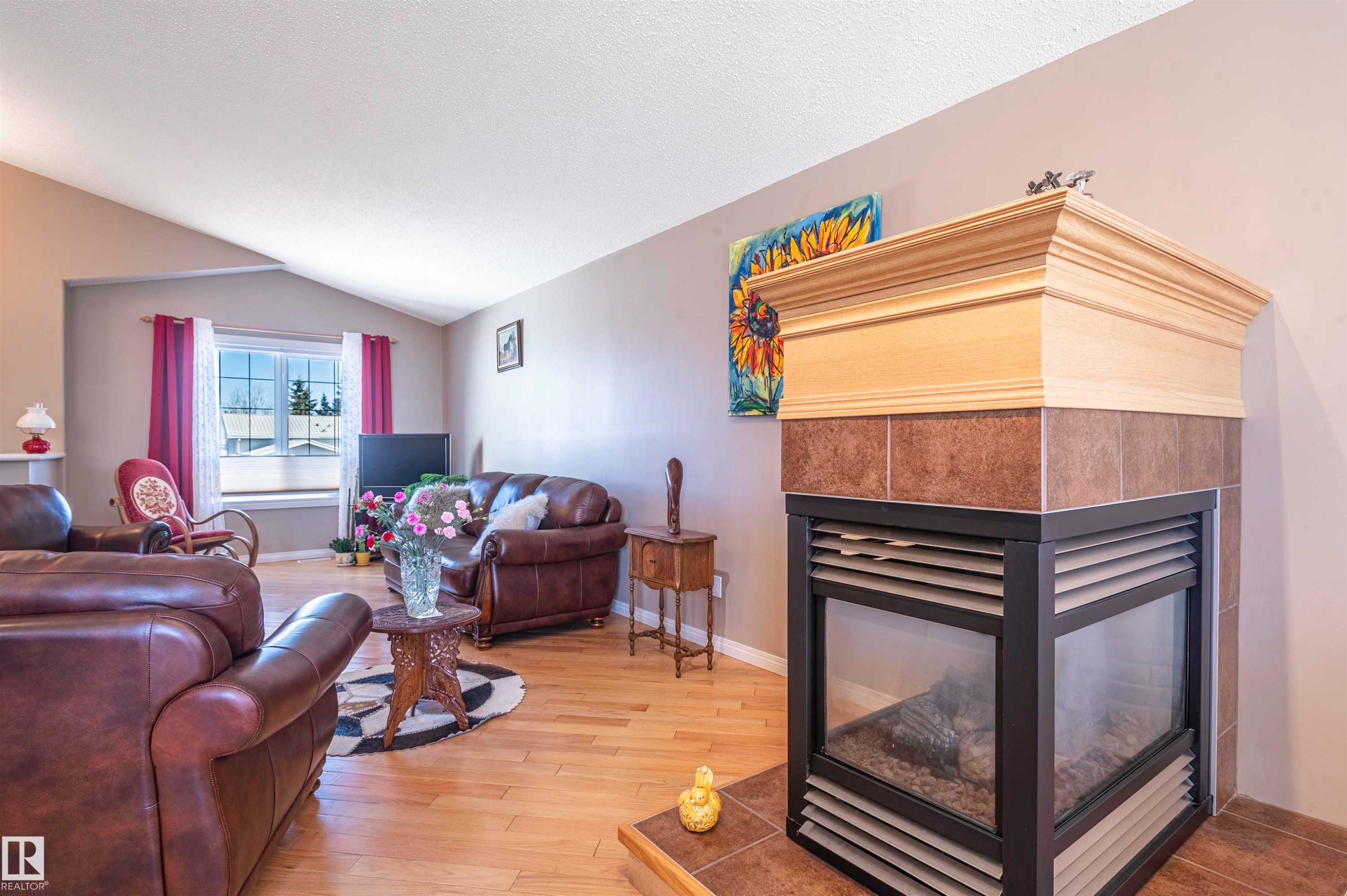 4431 48 Avenue, Clyde, AB - Indoor Photo Showing Living Room With Fireplace