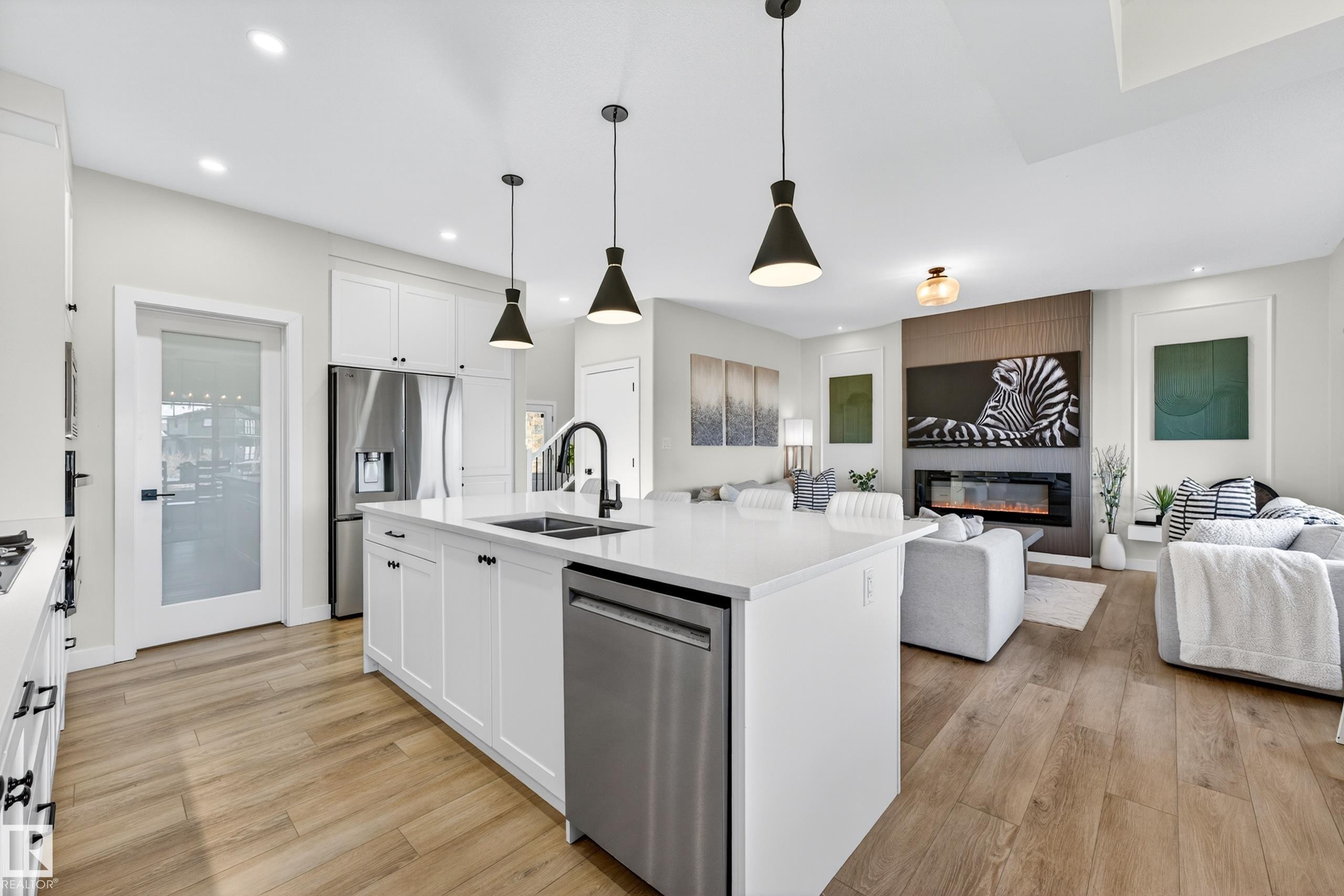 117 Kidd Crescent, Leduc, AB - Indoor Photo Showing Kitchen With Fireplace With Double Sink With Upgraded Kitchen
