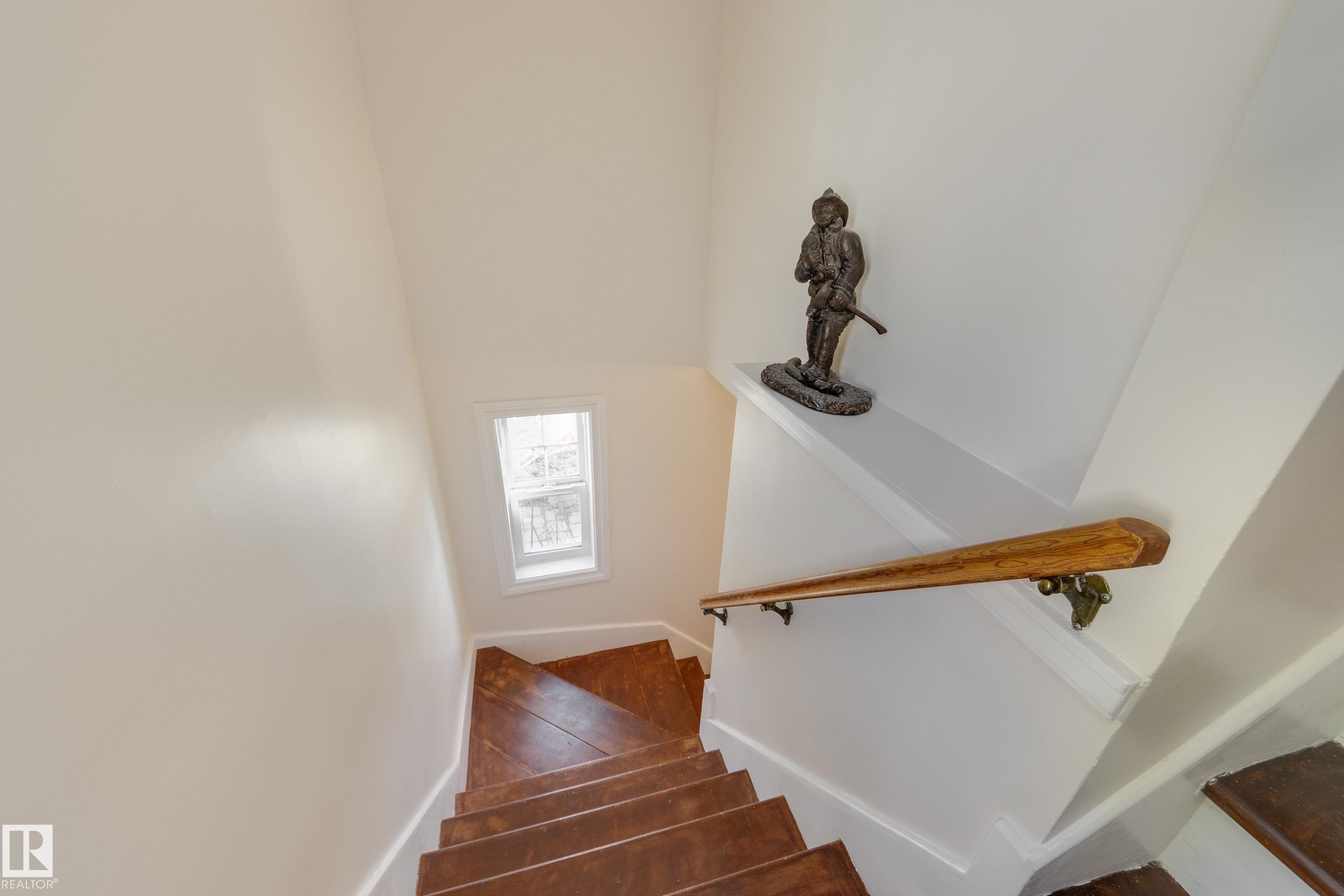 Hardwood treads and risers with a natural wood handrail - 11516 72 Avenue, Edmonton, AB - Indoor Photo Showing Other Room