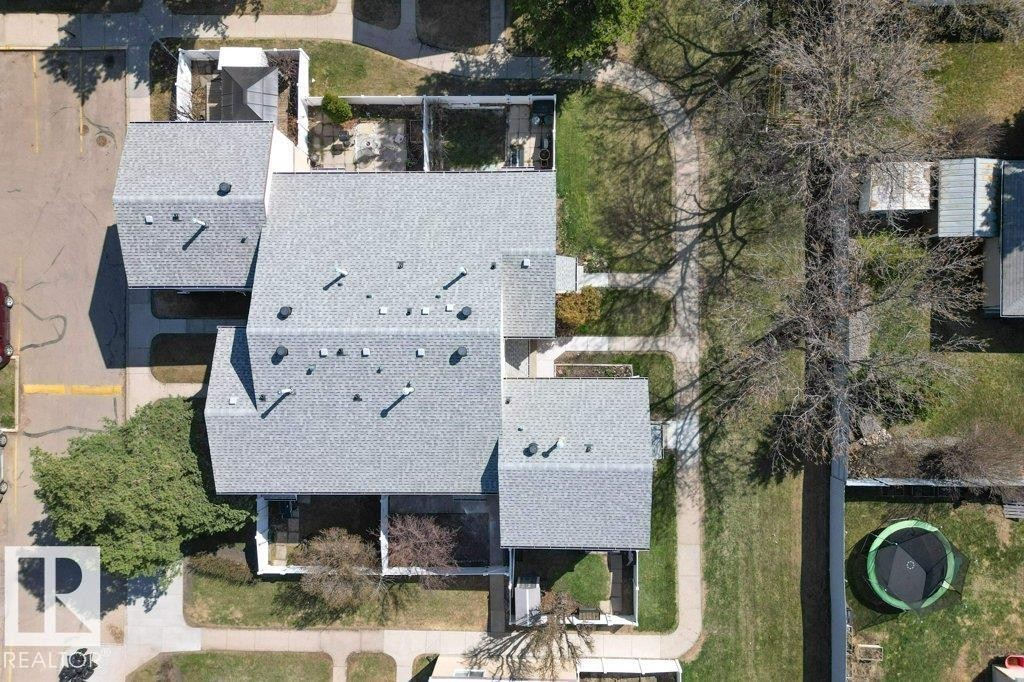 Aerial perspective highlighting the property's roofline and surrounding landscaping - 3E Twin Terrace, Edmonton, AB - Outdoor