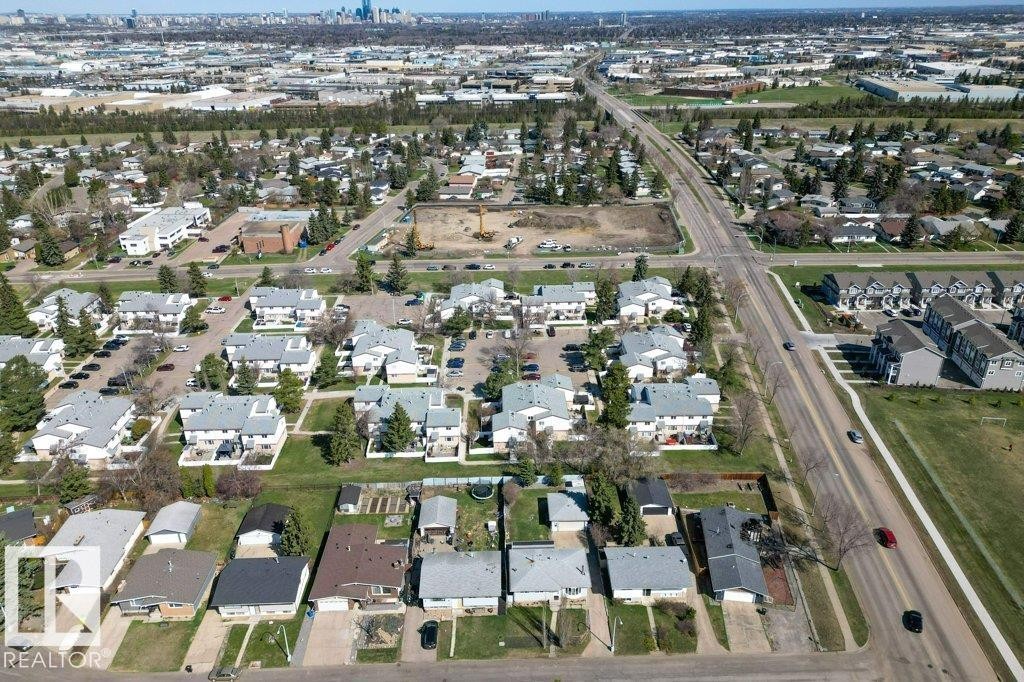 Aerial perspective showcasing a residential area with varied housing structures, including single-family homes and multi-unit dwellings - 3E Twin Terrace, Edmonton, AB - Outdoor With View