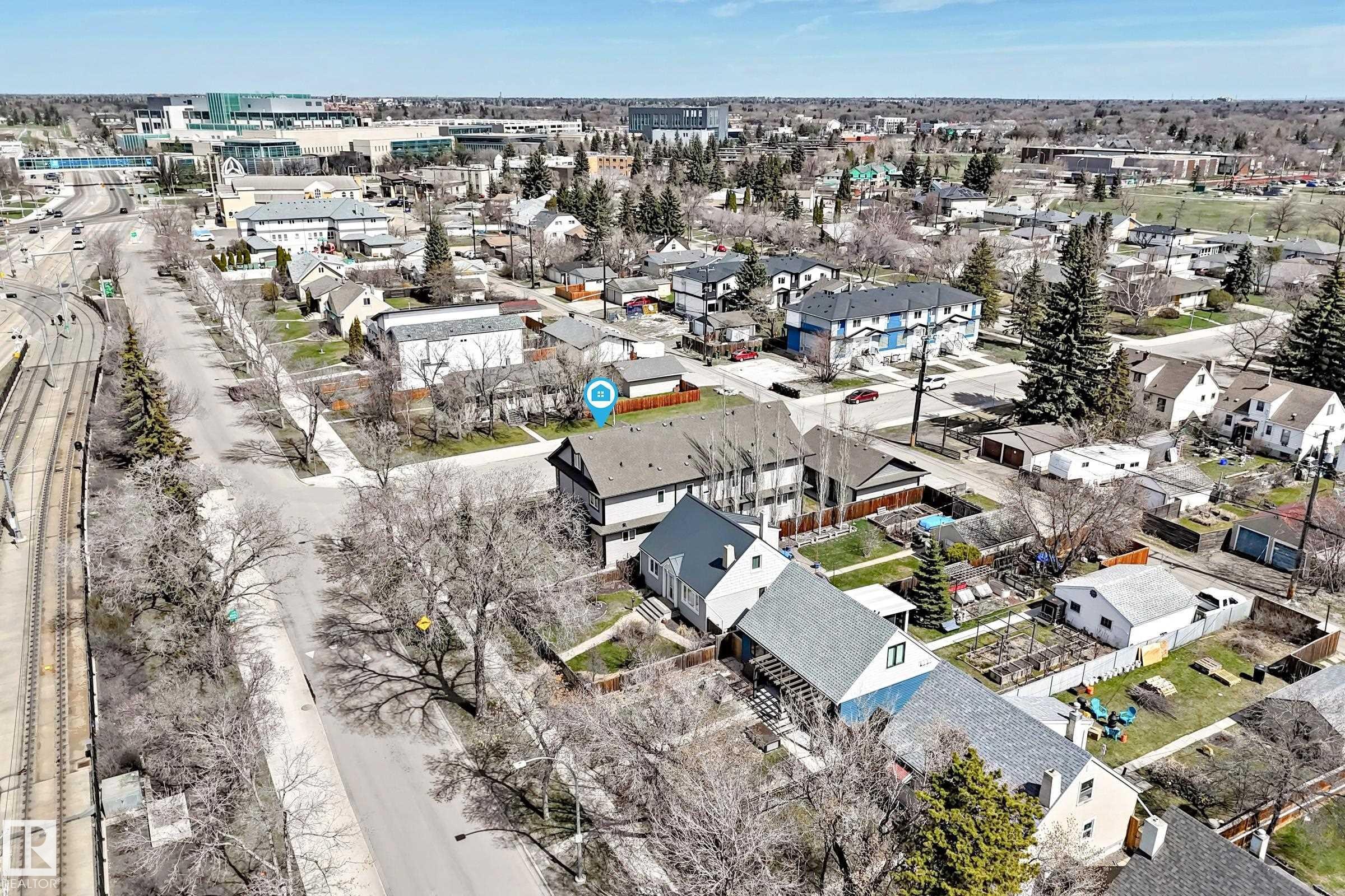 Aerial perspective showcasing the subject property's roofline and surrounding urban landscape - 10519 114 Avenue, Edmonton, AB - Outdoor With View