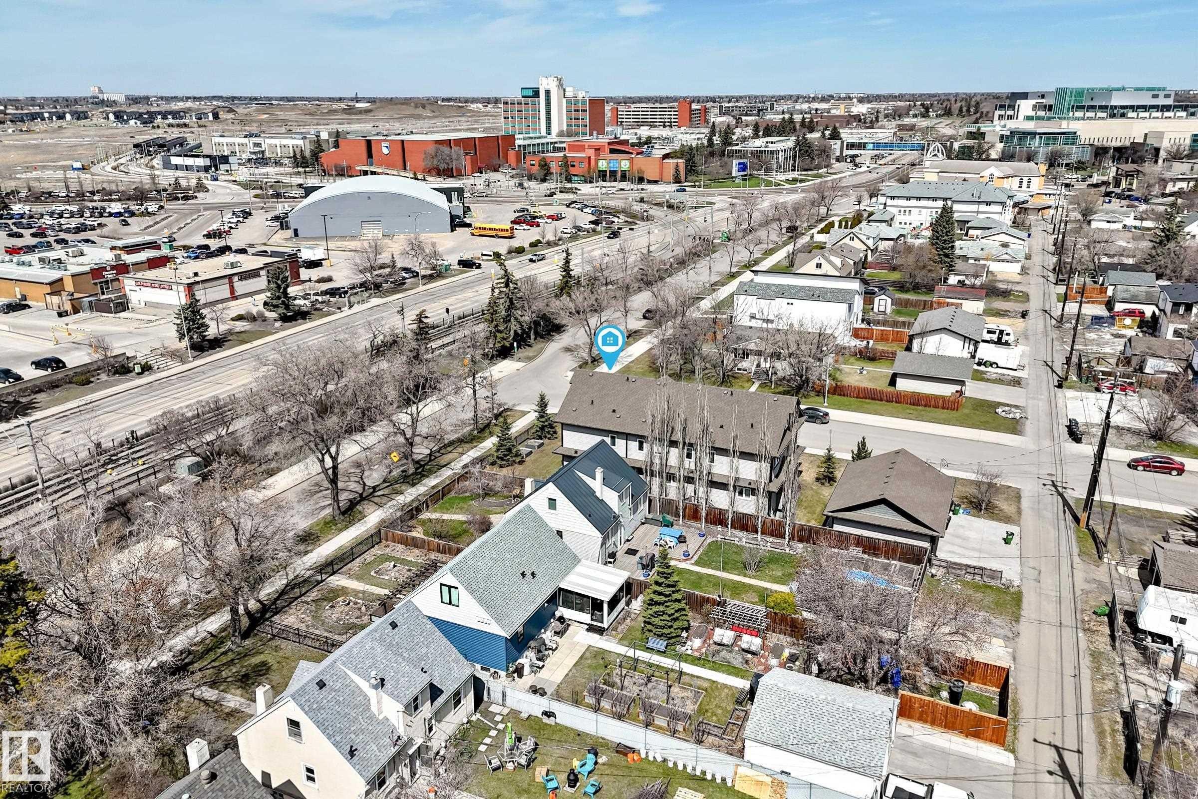 Aerial perspective showcasing multiple residential structures with pitched roofs - 10519 114 Avenue, Edmonton, AB - Outdoor With View
