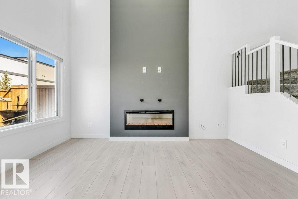 5140 23 Avenue, Edmonton, AB - Indoor Photo Showing Living Room With Fireplace