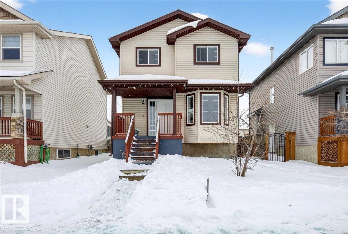 View of front of home with a gate - 150 Acacia Circle, Leduc, AB - Outdoor With Facade