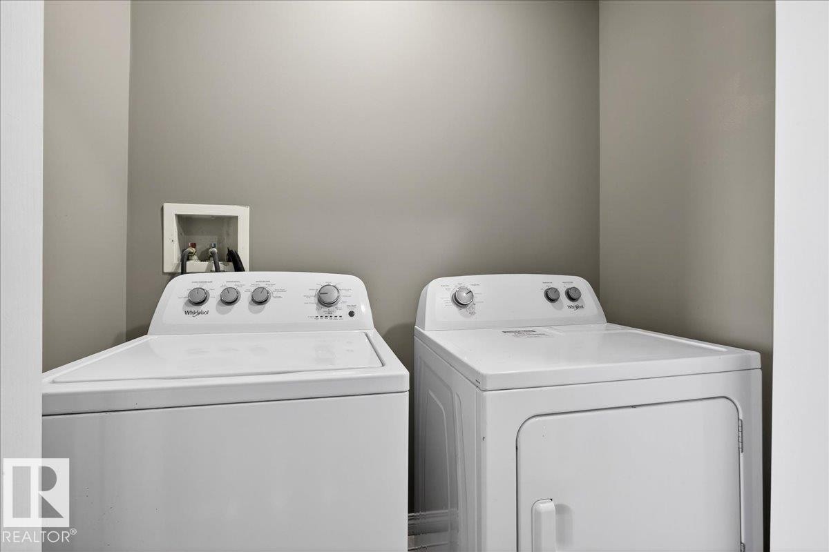Laundry room with washing machine and dryer - 150 Acacia Circle, Leduc, AB - Indoor Photo Showing Laundry Room