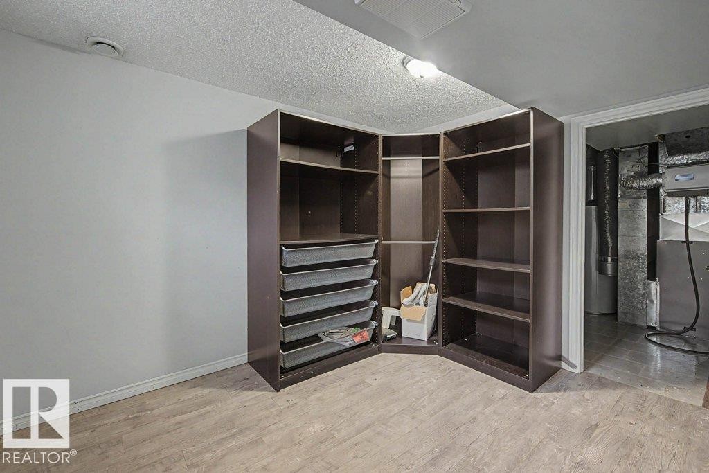 This space offers built-in shelving and drawers, providing storage solutions - Edmonton, AB - Indoor