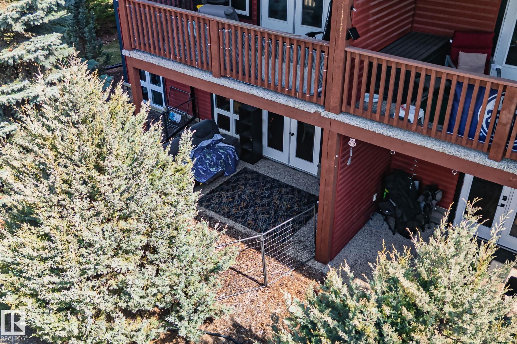 Terraced exterior featuring wood siding and balconies - 2201 Graybriar Green, Stony Plain, AB - Outdoor
