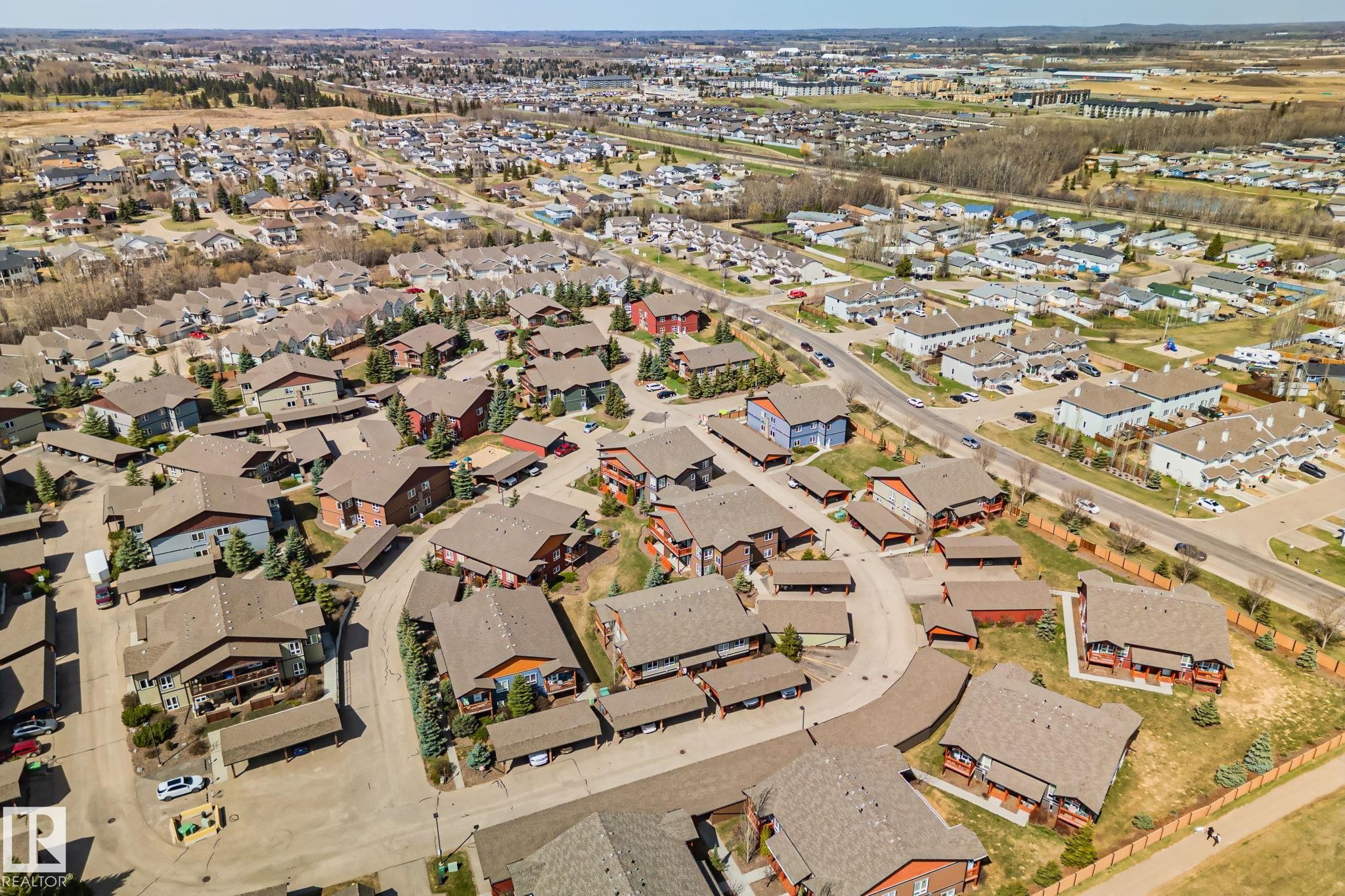 Aerial perspective showcasing a residential community with varying architectural styles - 2201 Graybriar Green, Stony Plain, AB - Outdoor With View