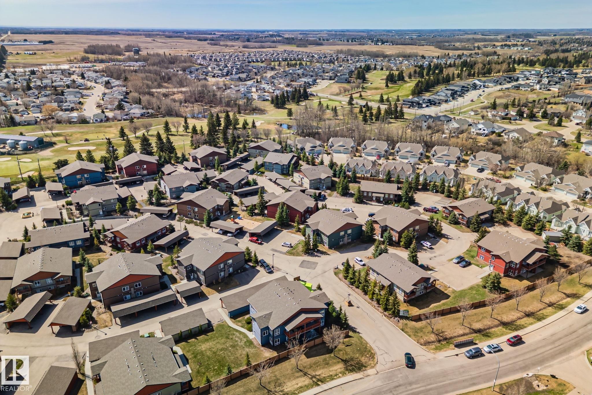 Aerial perspective showcasing a residential community with varied architectural styles - 2201 Graybriar Green, Stony Plain, AB - Outdoor With View