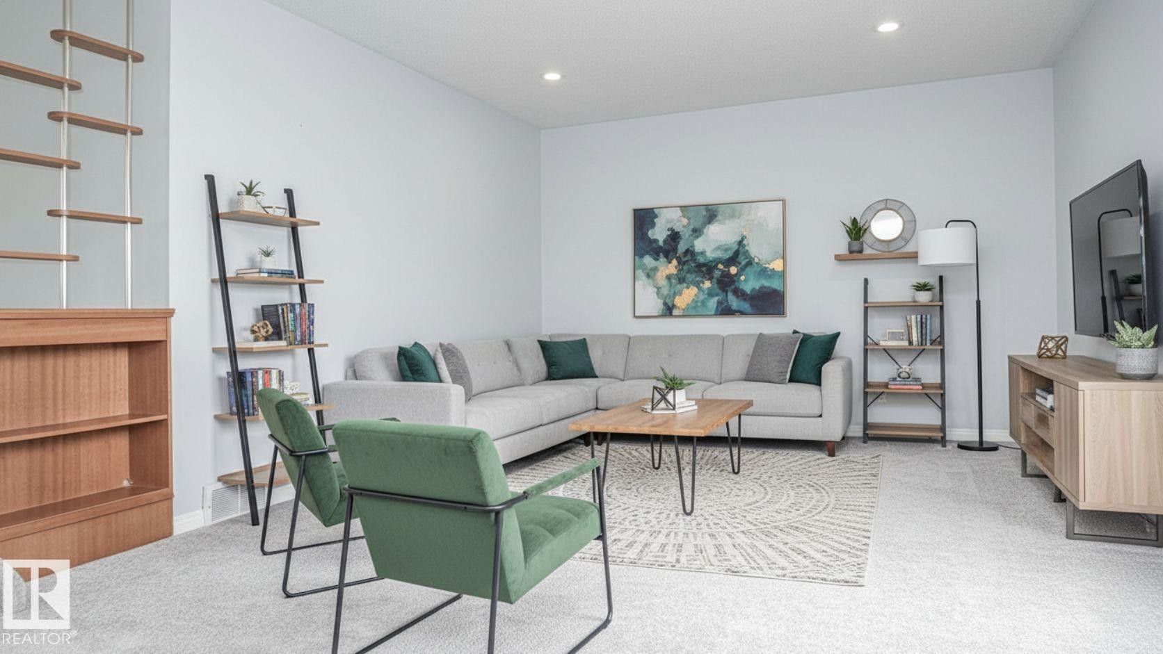Spacious living area featuring light gray wall paint, recessed lighting, and light-colored carpeting - 11131 52 Street, Edmonton, AB - Indoor Photo Showing Living Room