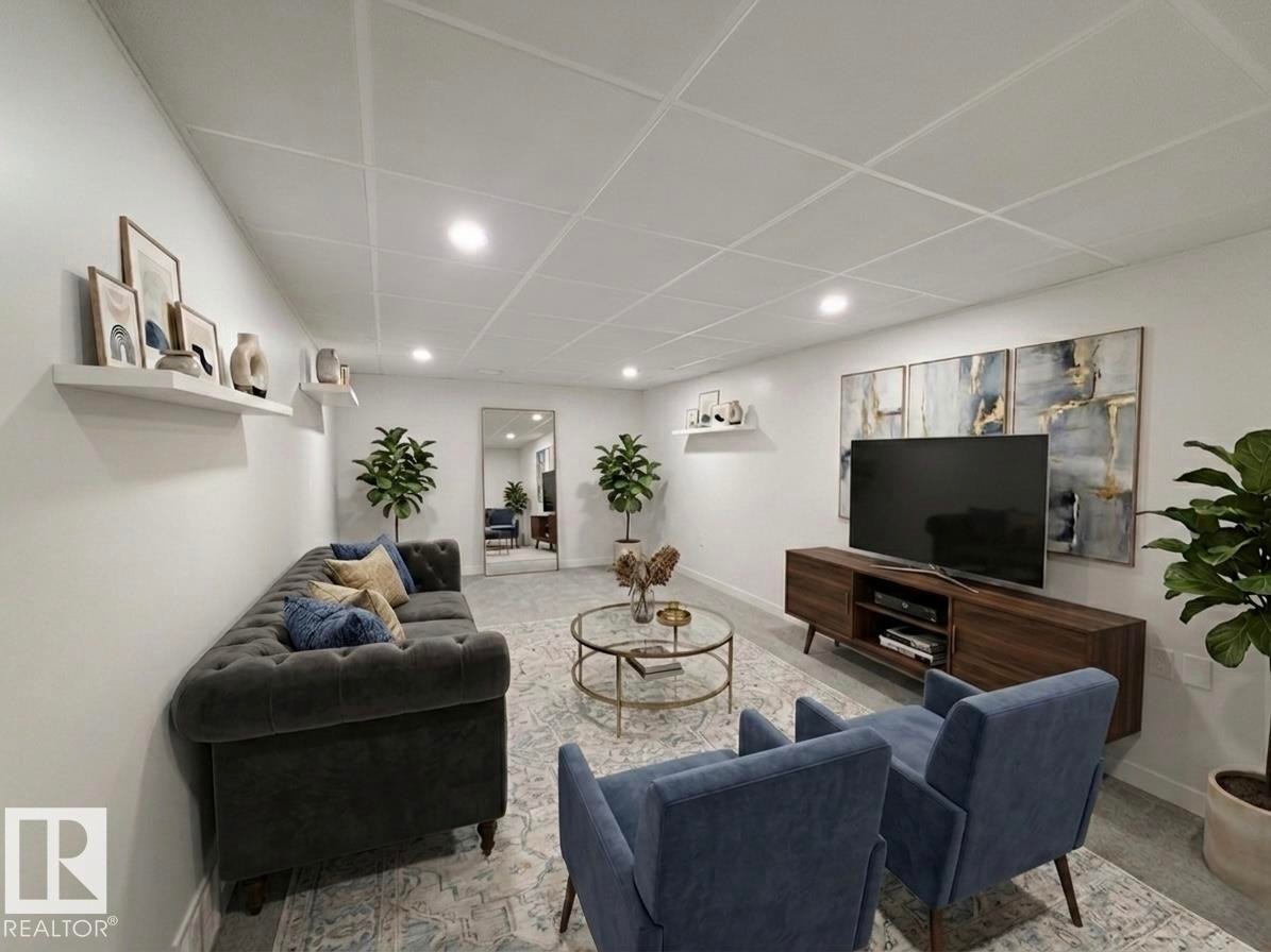Expansive living area with recessed lighting and a grid ceiling - 3912 108 Street, Edmonton, AB - Indoor Photo Showing Living Room