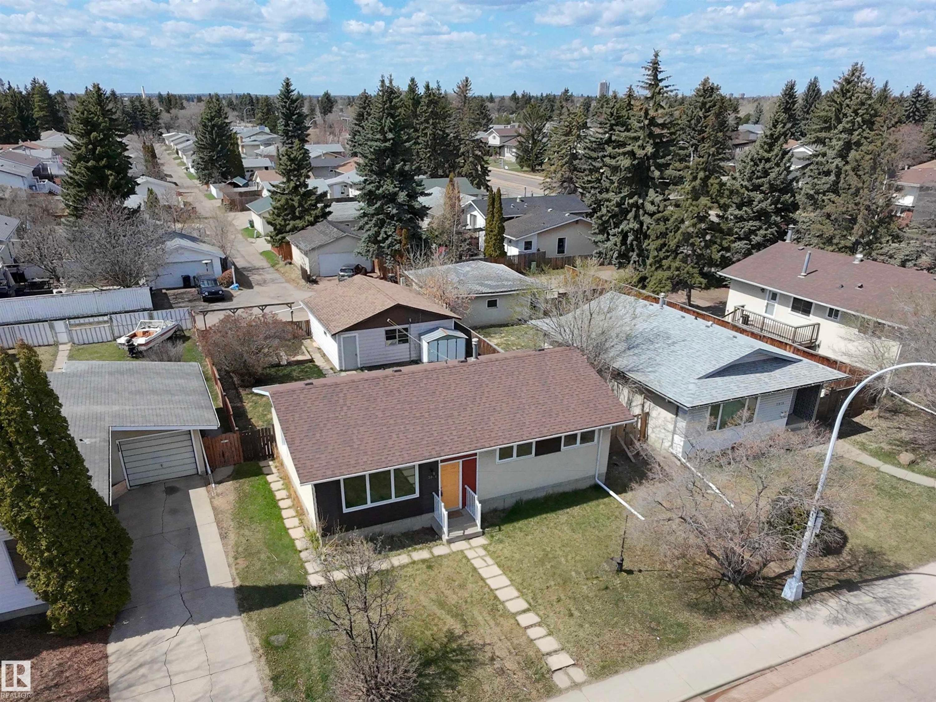 Single-story residence featuring a brown shingle roof and a grey and white exterior - 3912 108 Street, Edmonton, AB - Outdoor
