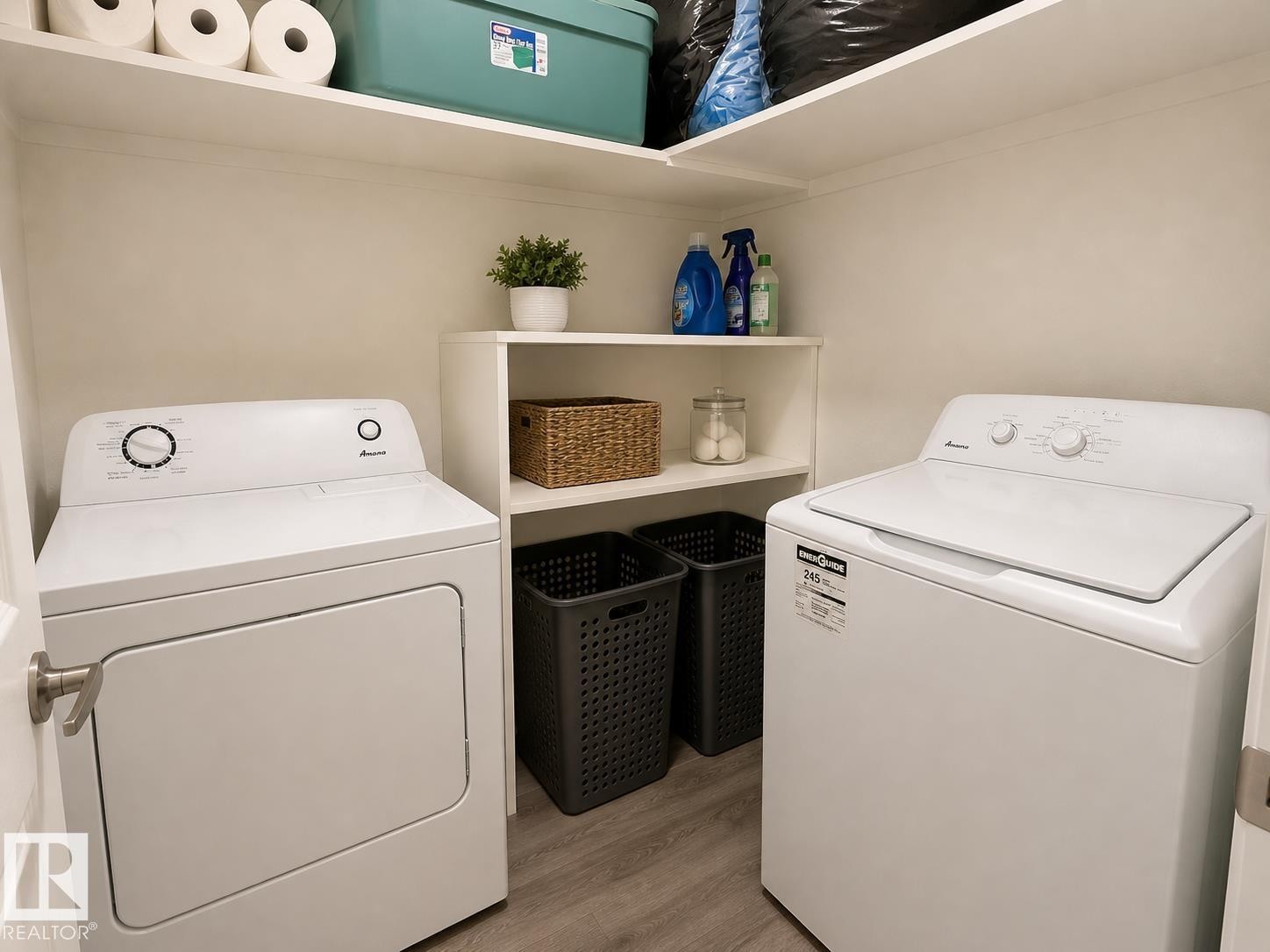 Dedicated laundry area featuring a white top-load washer and front-load dryer - 5712 101 Avenue, Edmonton, AB - Indoor Photo Showing Laundry Room