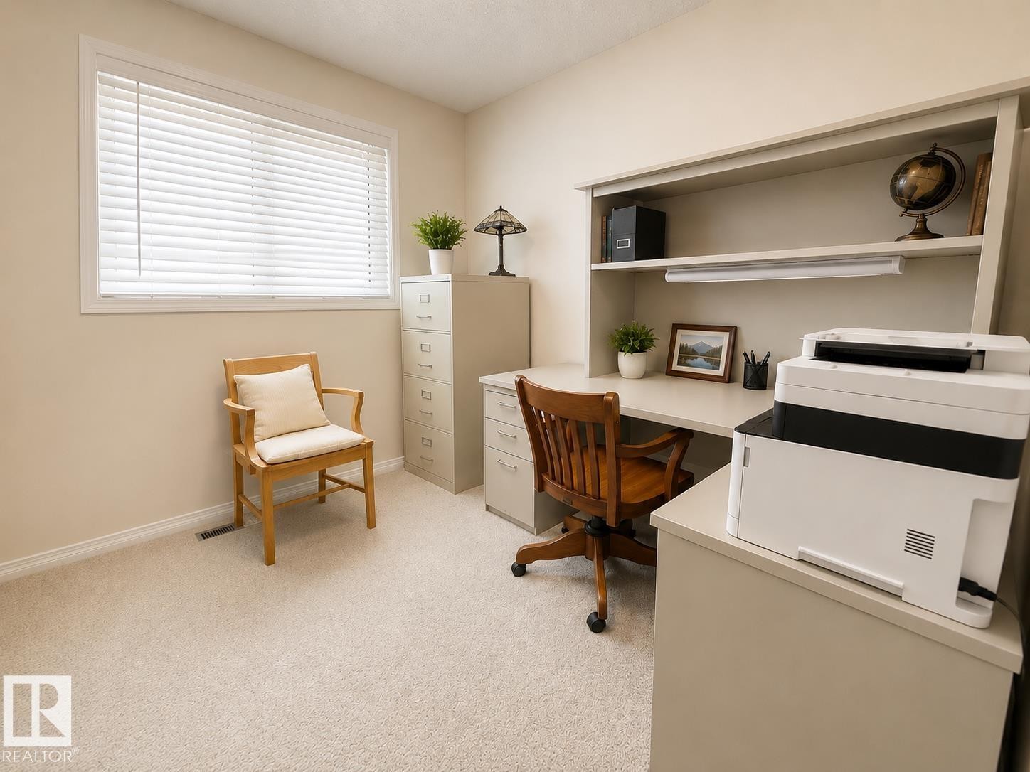 Built-in desk unit featuring integrated shelving and overhead lighting - 5712 101 Avenue, Edmonton, AB - Indoor Photo Showing Office