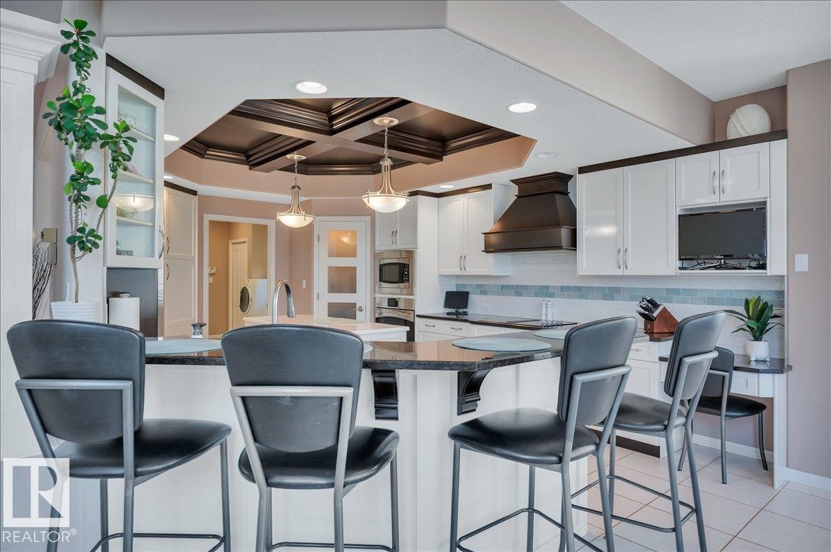 RAISED EATING BAR IN THE KITCHEN - 314 Weaver Point(E), Edmonton, AB - Indoor Photo Showing Dining Room
