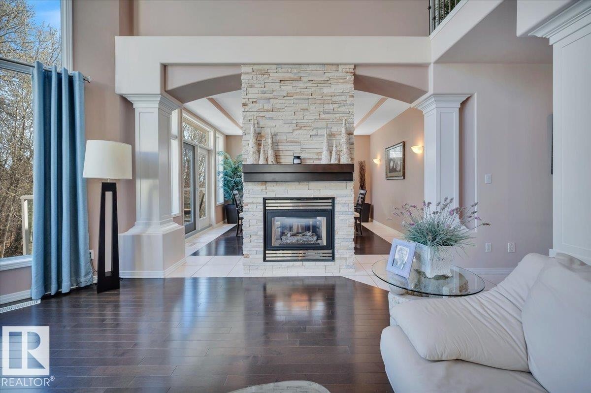 DUAL SIDED GAS FIREPLACE, SHARED WITH THE FORMAL DINING SPACE - 314 Weaver Point(E), Edmonton, AB - Indoor Photo Showing Living Room With Fireplace