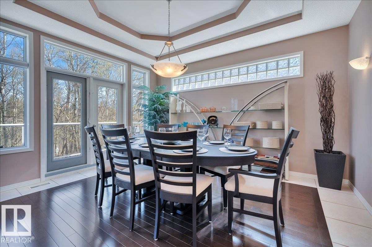 LARGE DINING ROOM WITH DOORS LEADING TO THE SECOND MAIN FLOOR BALCONY - 314 Weaver Point(E), Edmonton, AB - Indoor Photo Showing Dining Room
