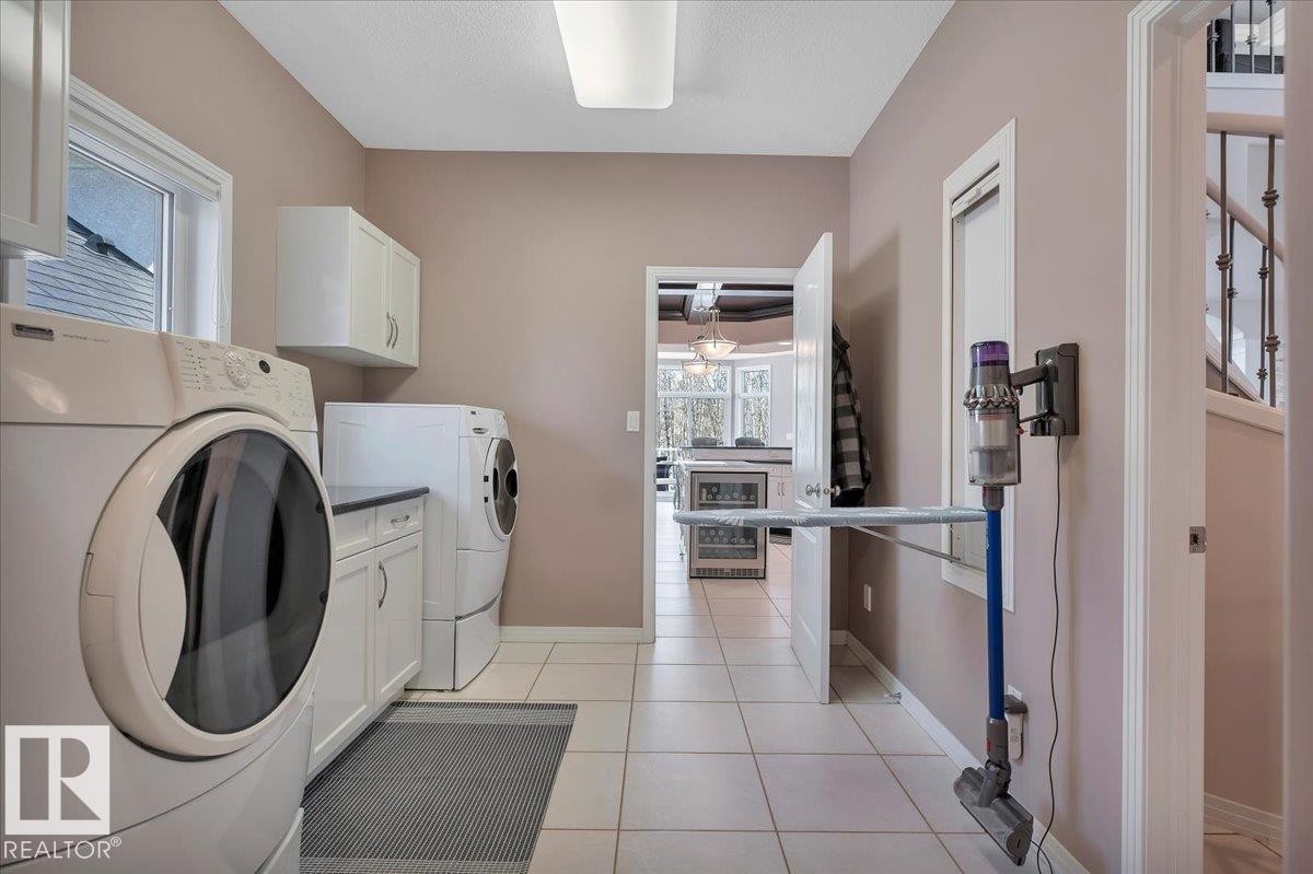 TAKE NOTE OF THE FOLD OUT IRONING BOARD! - 314 Weaver Point(E), Edmonton, AB - Indoor Photo Showing Laundry Room