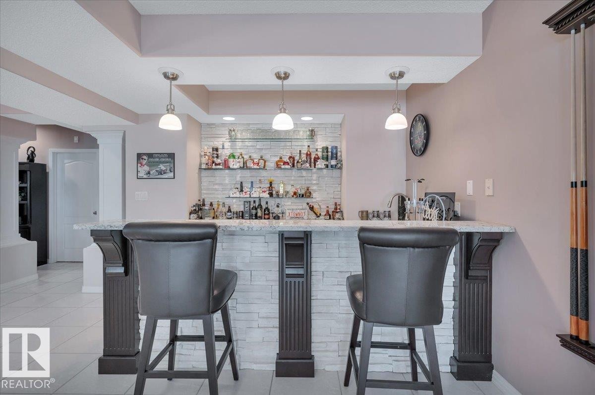 CUSTOM BAR WITH FLOATING SHELVES BUILT BY FULL HOUSE RENOVATIONS - 314 Weaver Point(E), Edmonton, AB - Indoor Photo Showing Dining Room