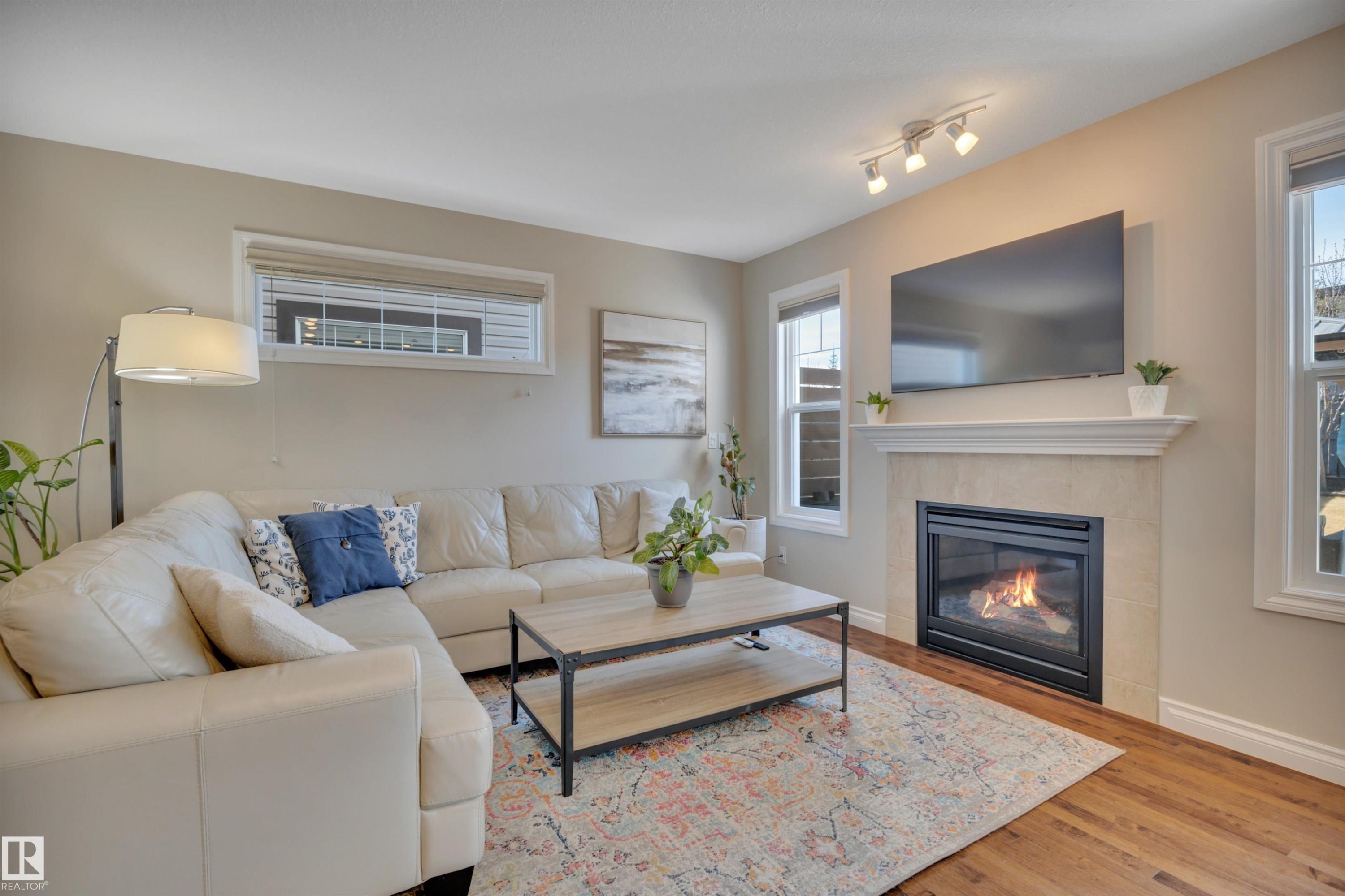 3911 Gallinger Loop, Edmonton, AB - Indoor Photo Showing Living Room With Fireplace