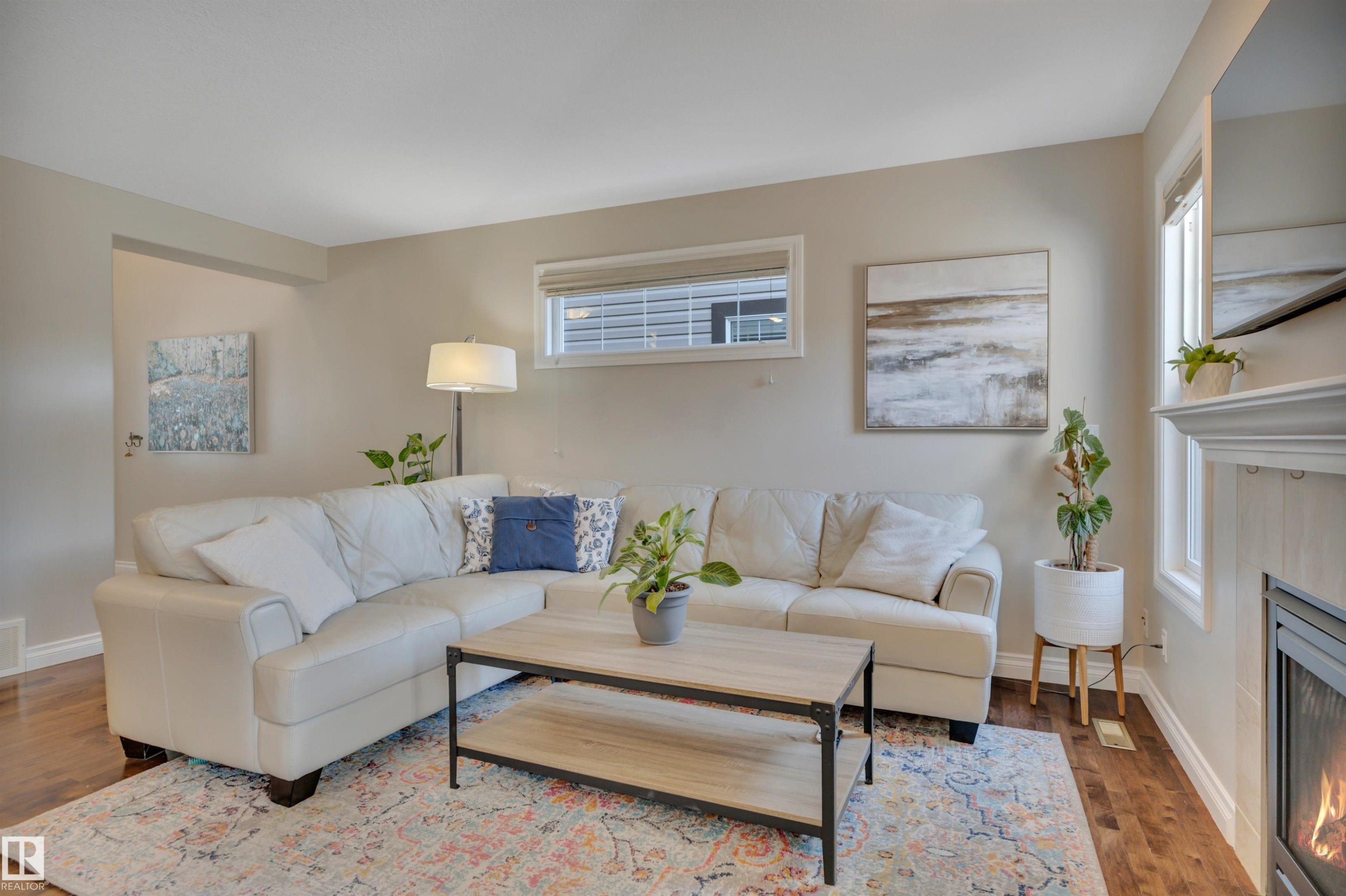 3911 Gallinger Loop, Edmonton, AB - Indoor Photo Showing Living Room With Fireplace