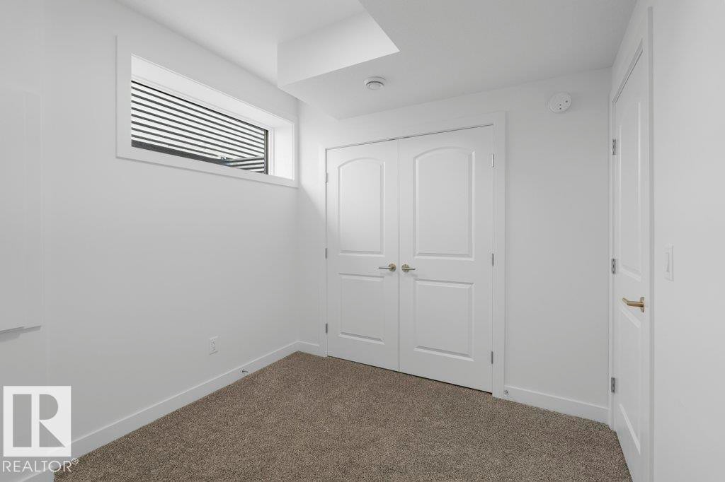 Room featuring plush carpeting and white painted walls - 19110 20A Avenue, Edmonton, AB - Indoor Photo Showing Other Room