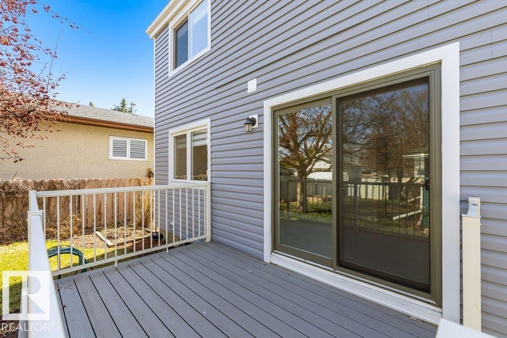 Outdoor deck featuring gray composite decking and white railing system - 3736 12 Avenue, Edmonton, AB - Outdoor With Deck Patio Veranda With Exterior