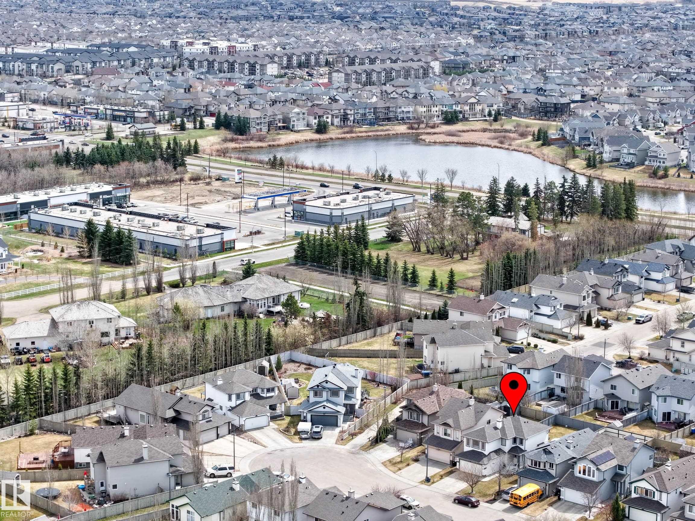 Aerial view highlighting the property within a residential area - 7723 7A Avenue, Edmonton, AB - Outdoor With Body Of Water With View