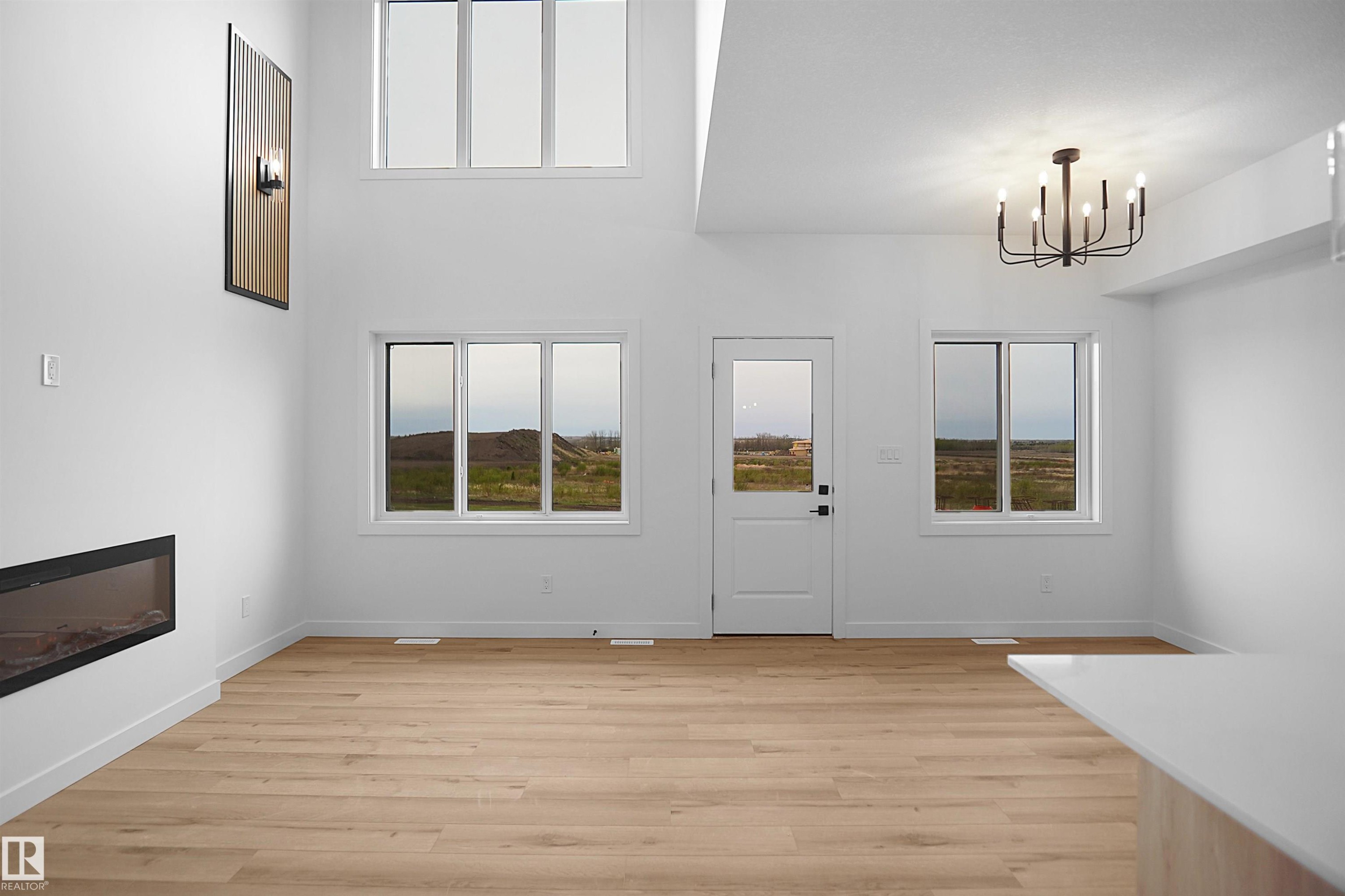 117 Peirwyck Loop, Spruce Grove, AB - Indoor Photo Showing Other Room With Fireplace