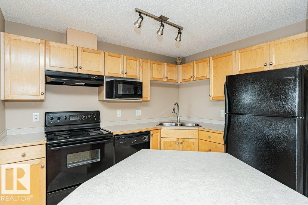 316 245 Edwards Drive, Edmonton, AB - Indoor Photo Showing Kitchen With Double Sink