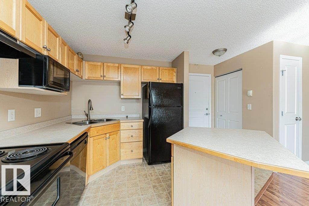 316 245 Edwards Drive, Edmonton, AB - Indoor Photo Showing Kitchen With Double Sink
