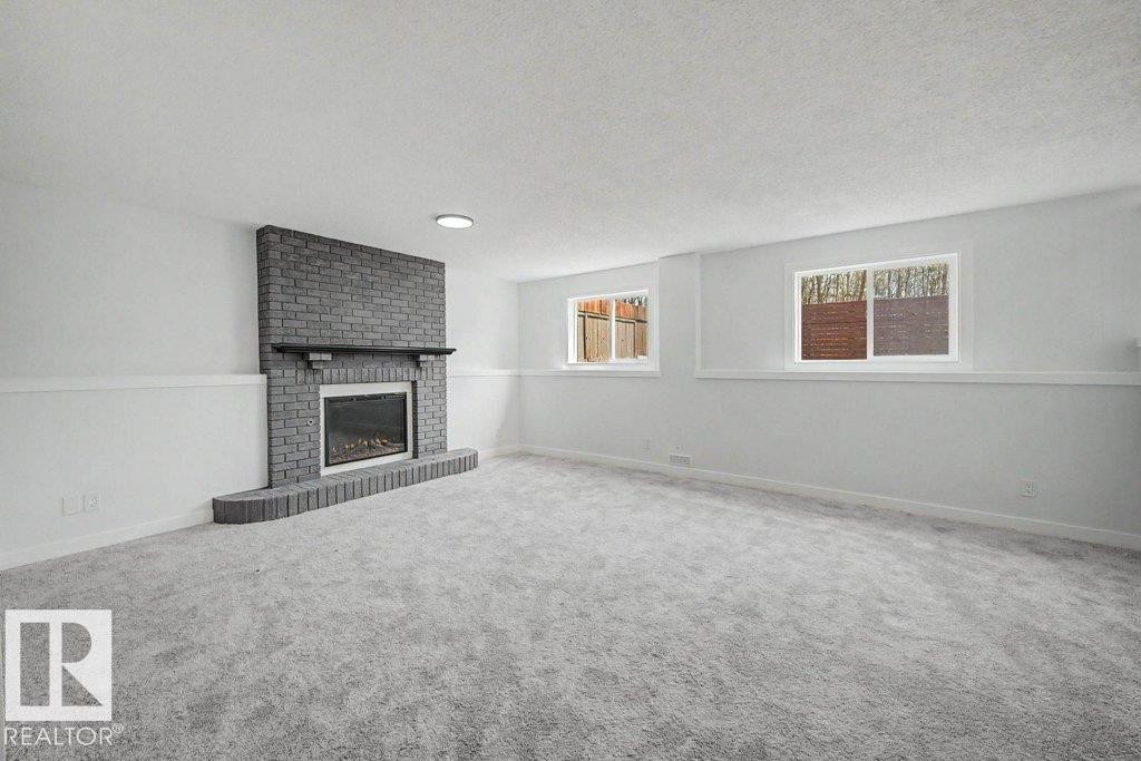 67A Arbor Crescent, St. Albert, AB - Indoor Photo Showing Living Room With Fireplace
