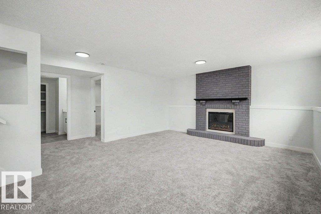 67A Arbor Crescent, St. Albert, AB - Indoor Photo Showing Other Room With Fireplace