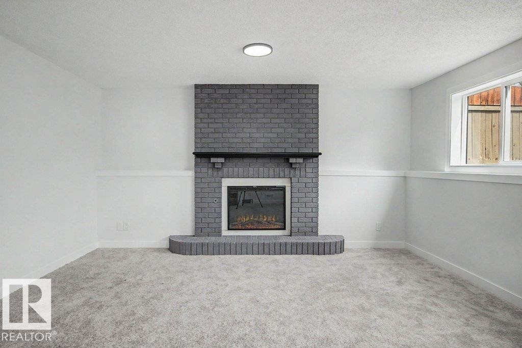 67A Arbor Crescent, St. Albert, AB - Indoor Photo Showing Other Room With Fireplace