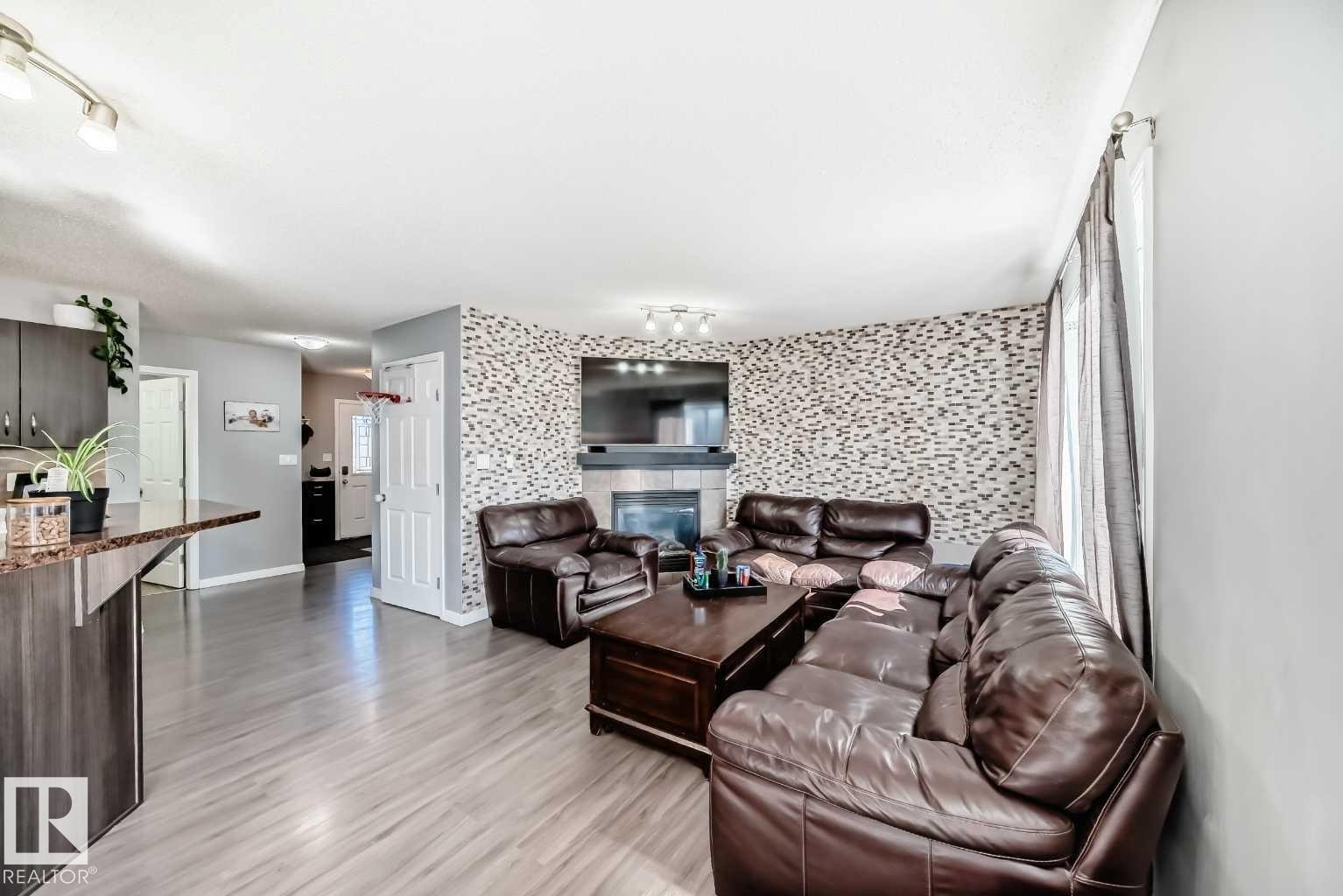 227 Avena Circle, Leduc, AB - Indoor Photo Showing Living Room With Fireplace