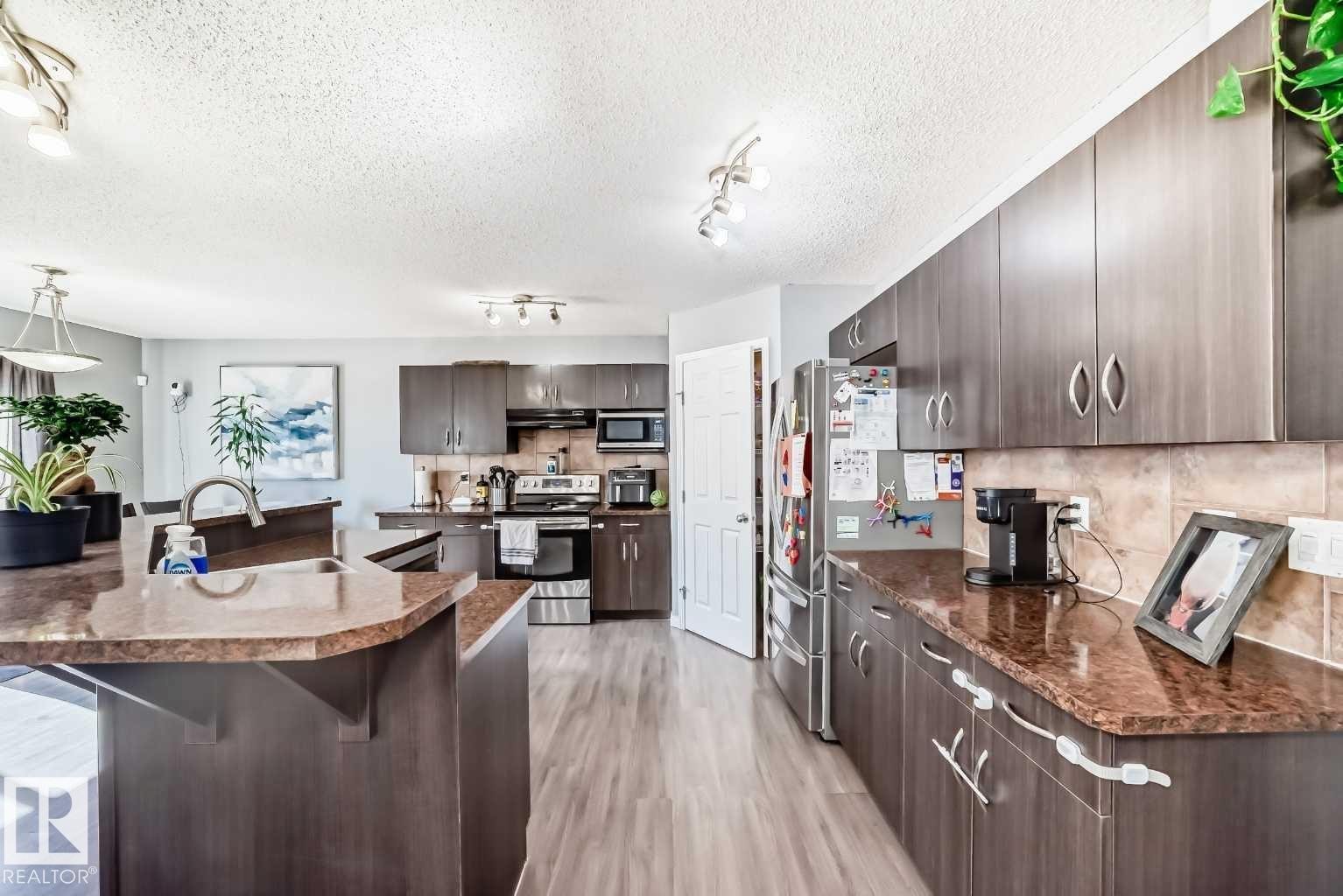 227 Avena Circle, Leduc, AB - Indoor Photo Showing Kitchen With Double Sink