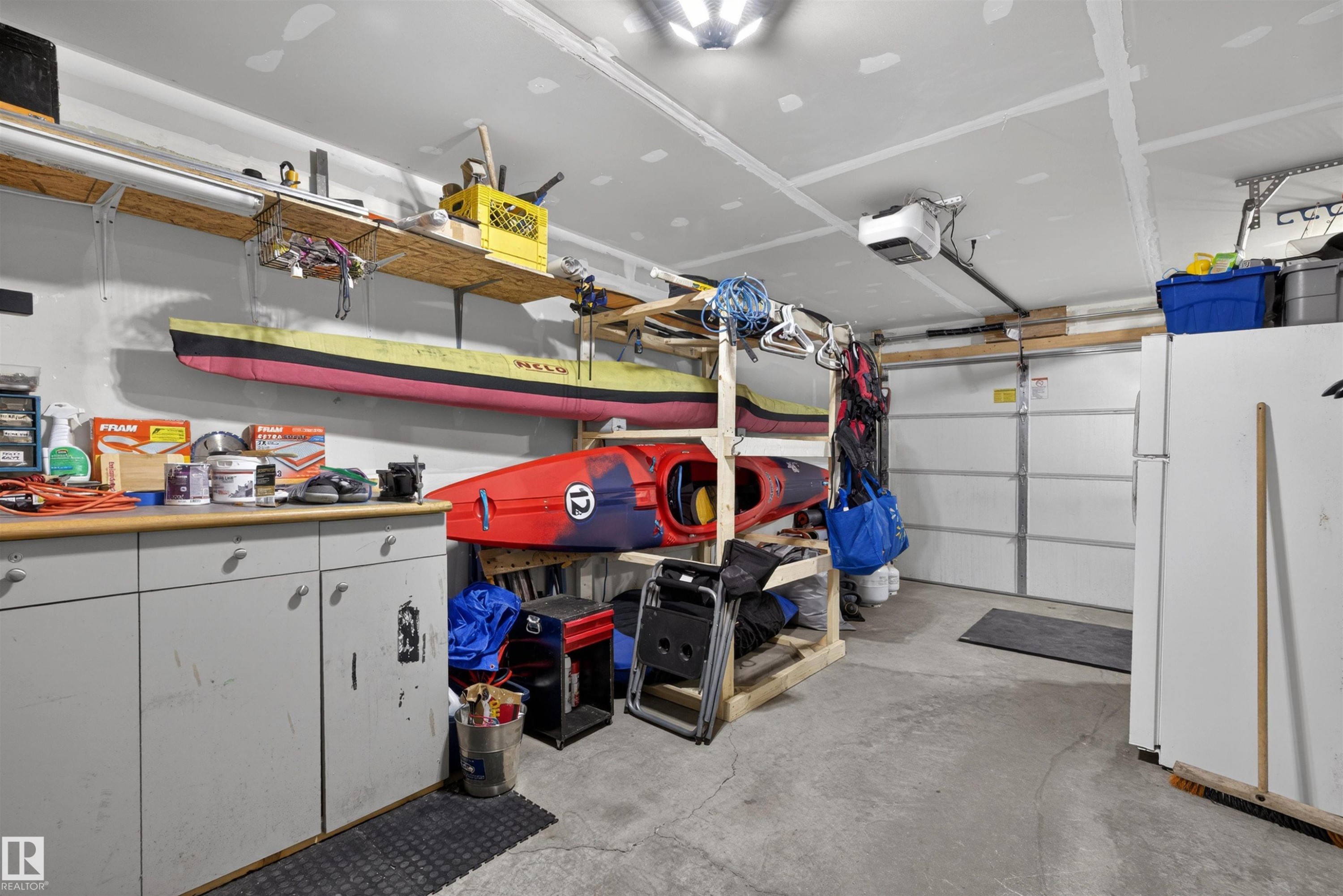 8 2560 Pegasus Boulevard, Edmonton, AB - Indoor Photo Showing Garage