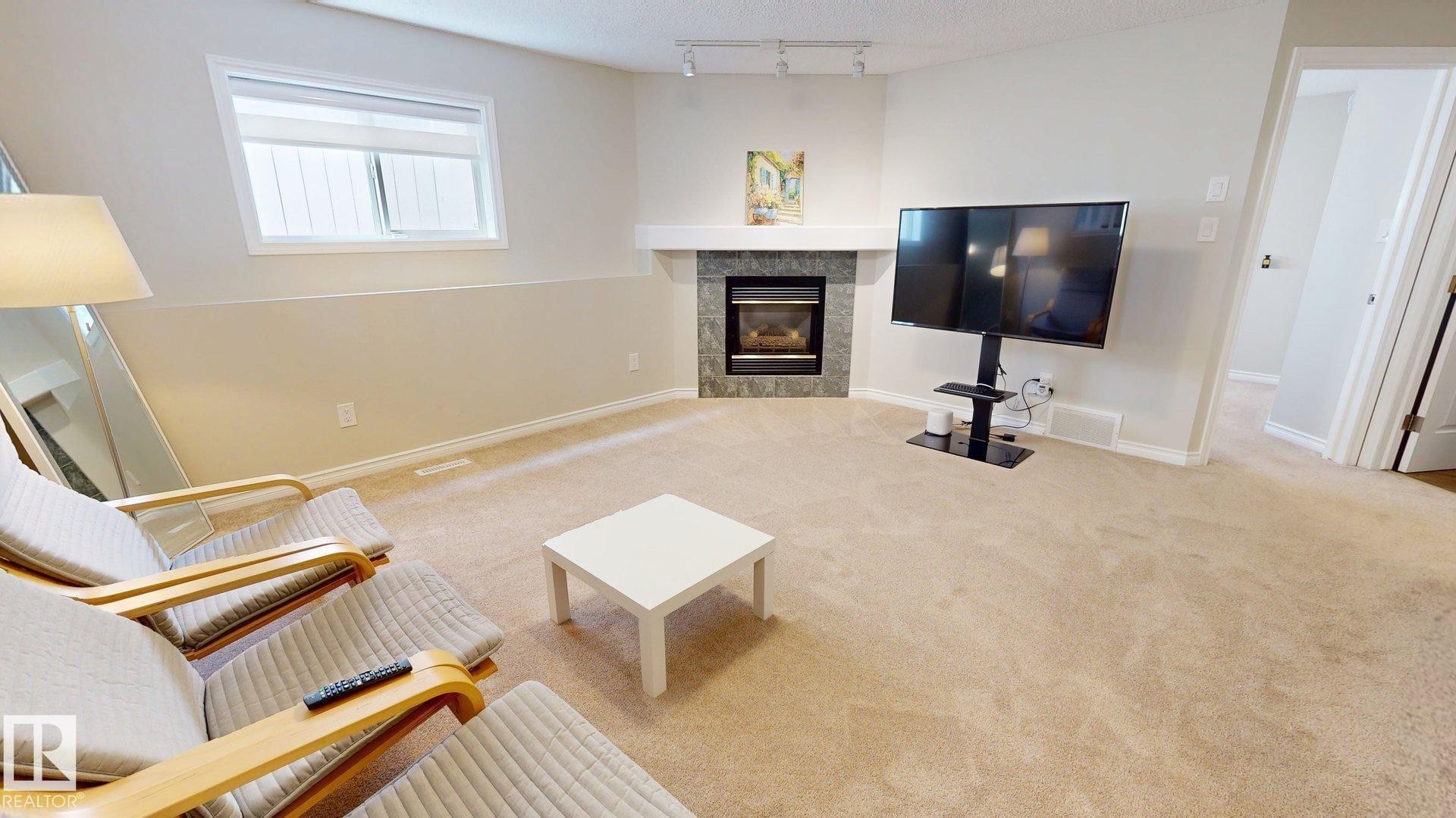2078 Tanner Wynd, Edmonton, AB - Indoor Photo Showing Living Room With Fireplace