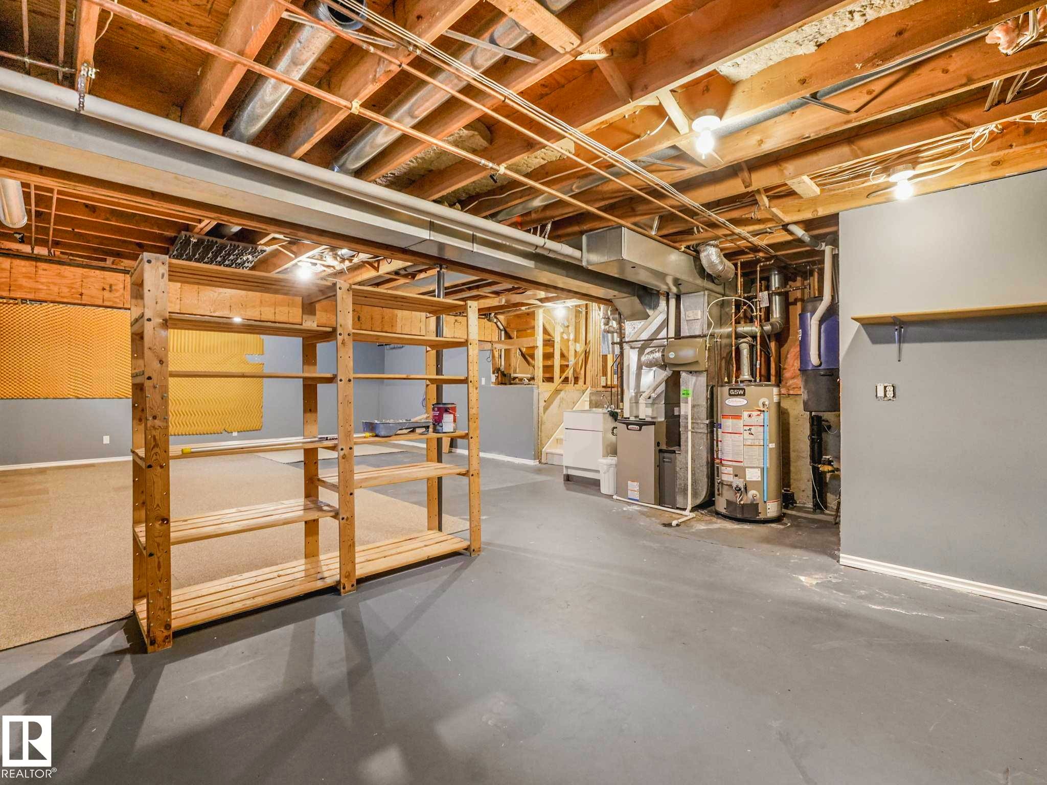 Unfinished basement offering expansive open space, exposed ceiling joists, and utility access - 4011 104 Street, Edmonton, AB - Indoor Photo Showing Basement