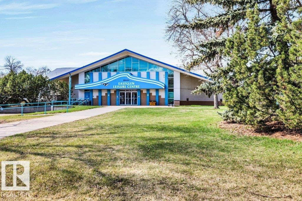 Large-scale recreational facility featuring a prominent gabled roofline and a vibrant blue and white facade - 11445 68 Street, Edmonton, AB - Outdoor