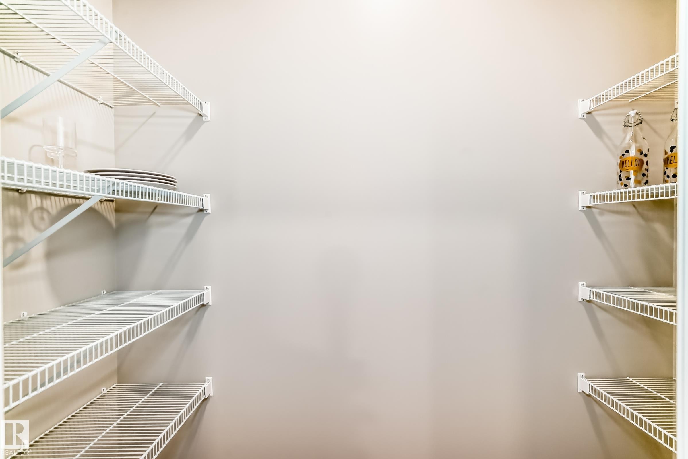 Walk-in pantry featuring white wire shelving - 1603 206 Street, Edmonton, AB - Indoor With Storage