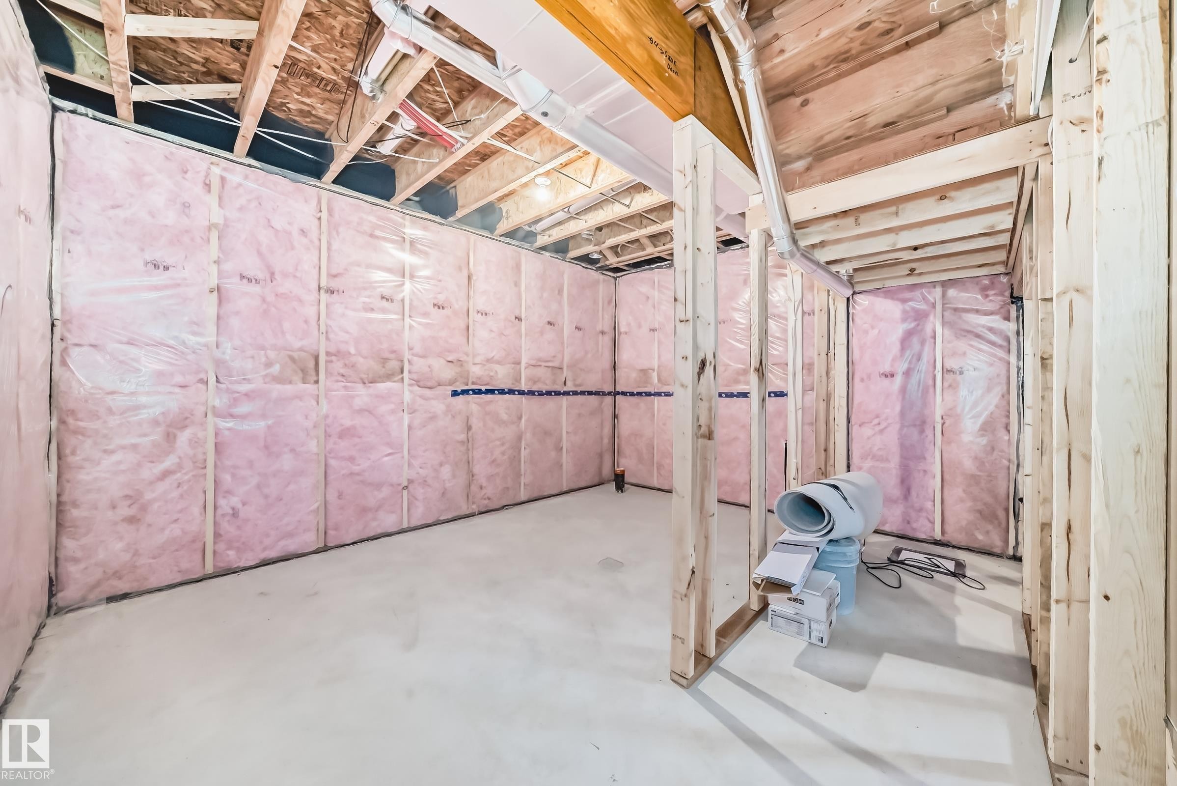 Unfinished basement space featuring exposed wood framing, insulated walls, and a concrete floor - 1603 206 Street, Edmonton, AB - Indoor Photo Showing Basement