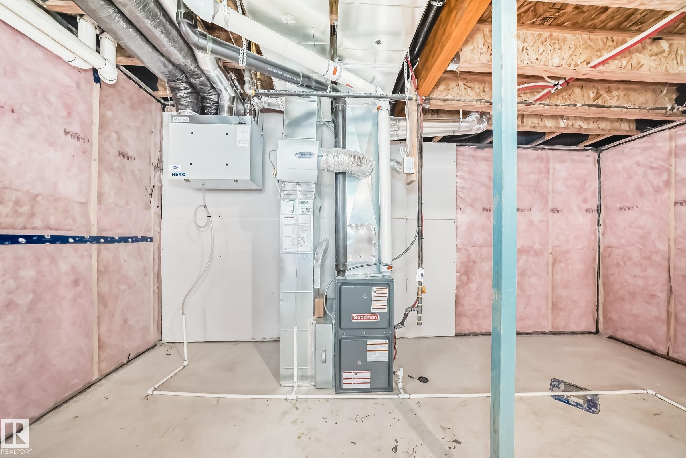 Utility room featuring a furnace, water heater, and exposed ceiling joists - 1603 206 Street, Edmonton, AB - Indoor Photo Showing Basement
