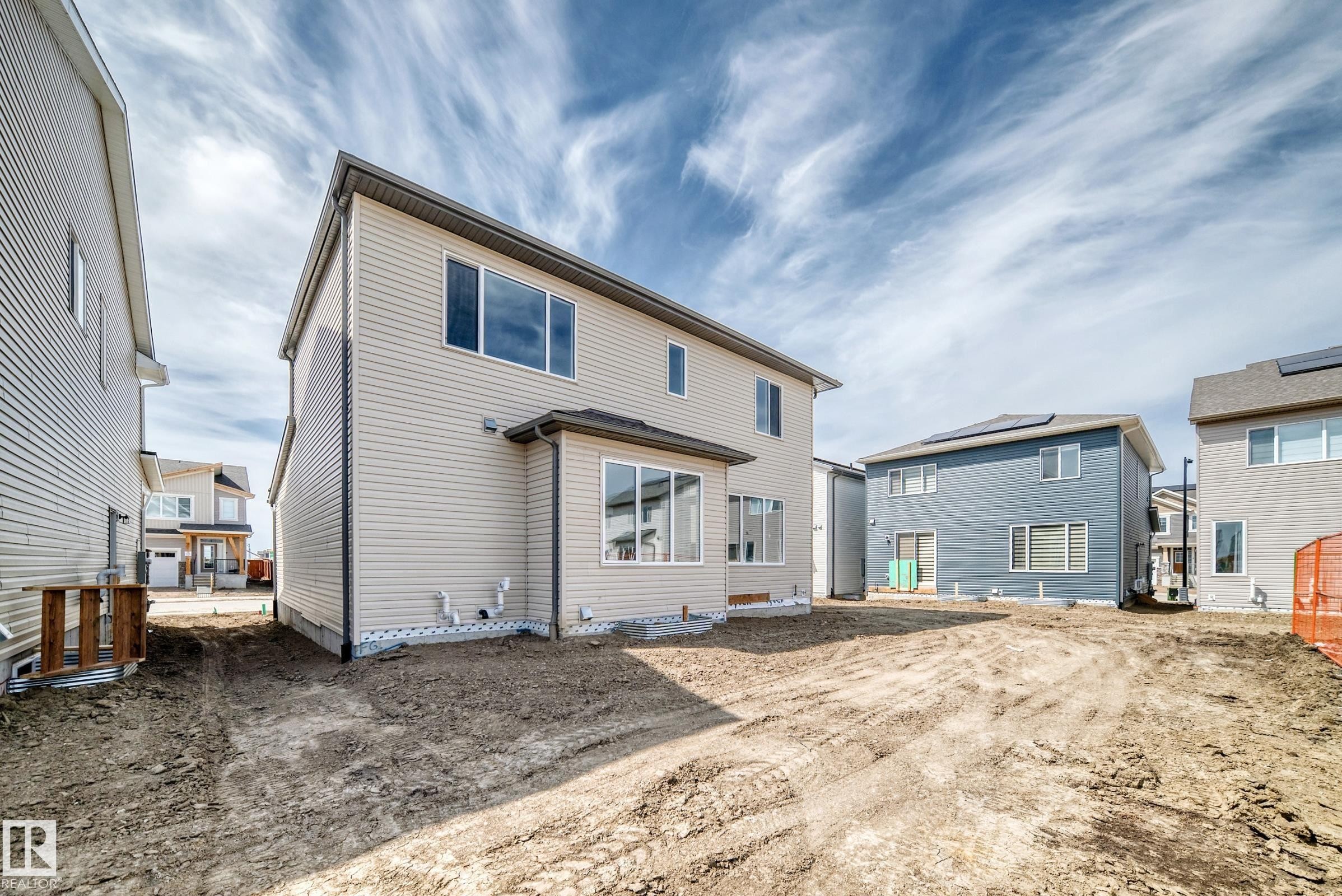 Expansive backyard space with a newly constructed two-story residence - 1603 206 Street, Edmonton, AB - Outdoor With Exterior